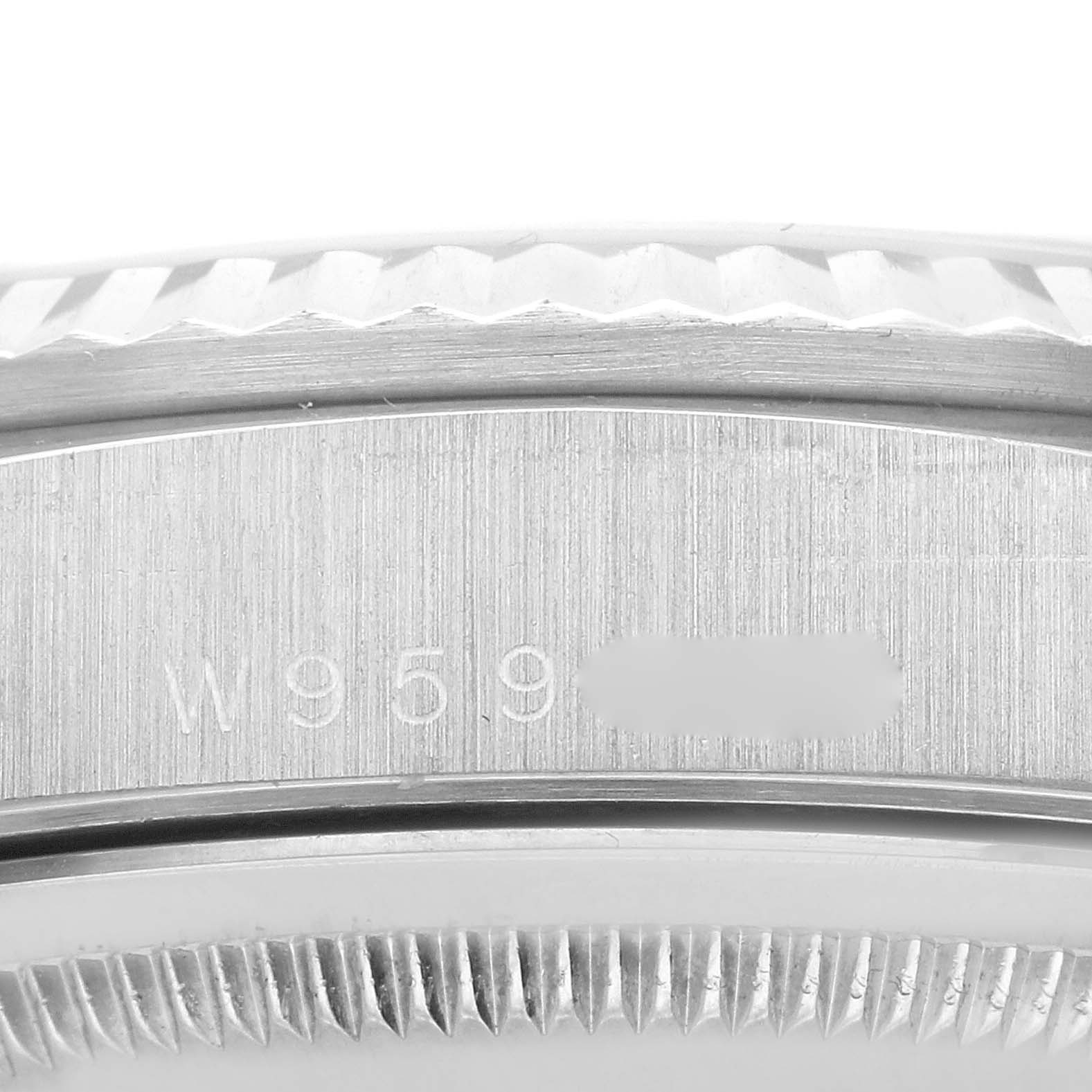 This image shows a close-up of the case with the serial number of a Rolex President 18239 Men's White Gold Silver Dial 18239 Men's White Gold Silver Dial model watch.