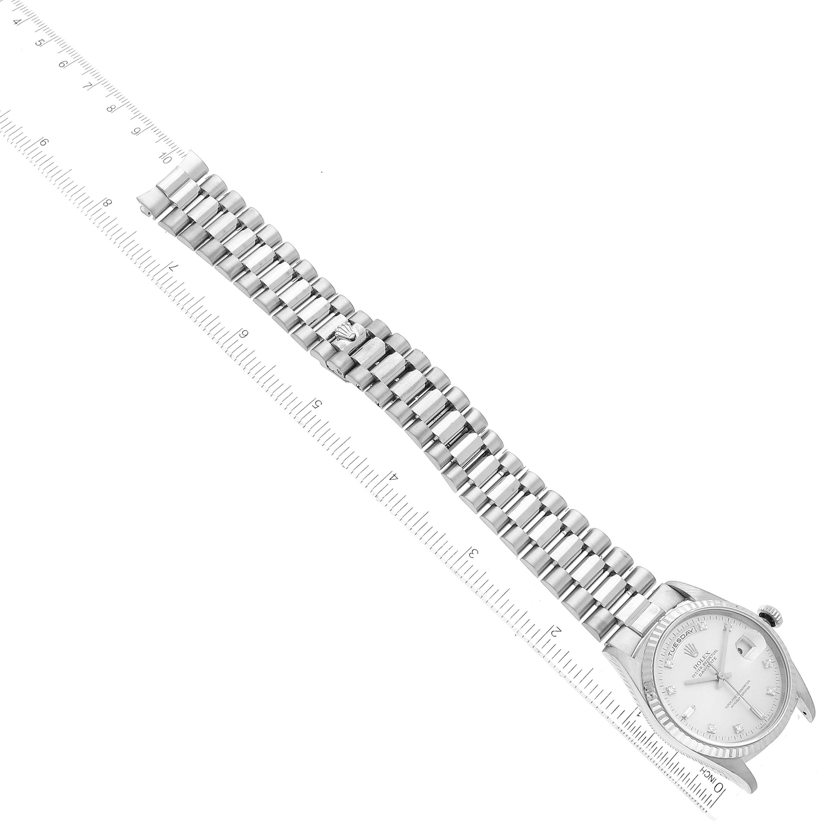 The image shows a top-down view of a Rolex President 18239 Men's White Gold Silver Dial 18239 Men's White Gold Silver Dial model watch, displaying its full face and metal bracelet with a ruler beside it.