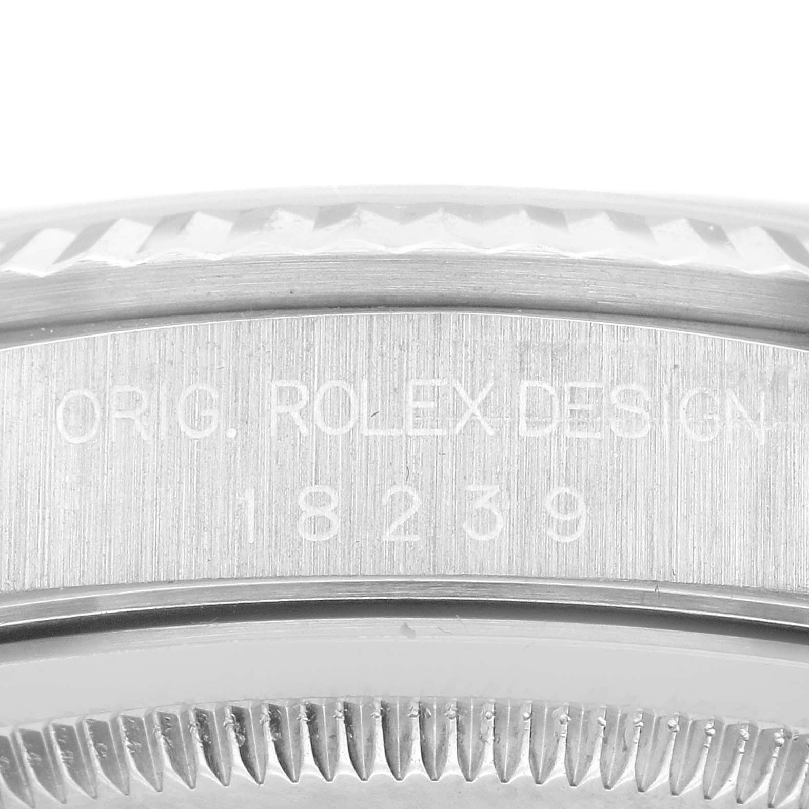 The image shows a close-up of the side of the Rolex President 18239 Men's White Gold Silver Dial 18239 Men's White Gold Silver Dial model, focusing on the bezel and case, with "Rolex Design" and model number engraved.