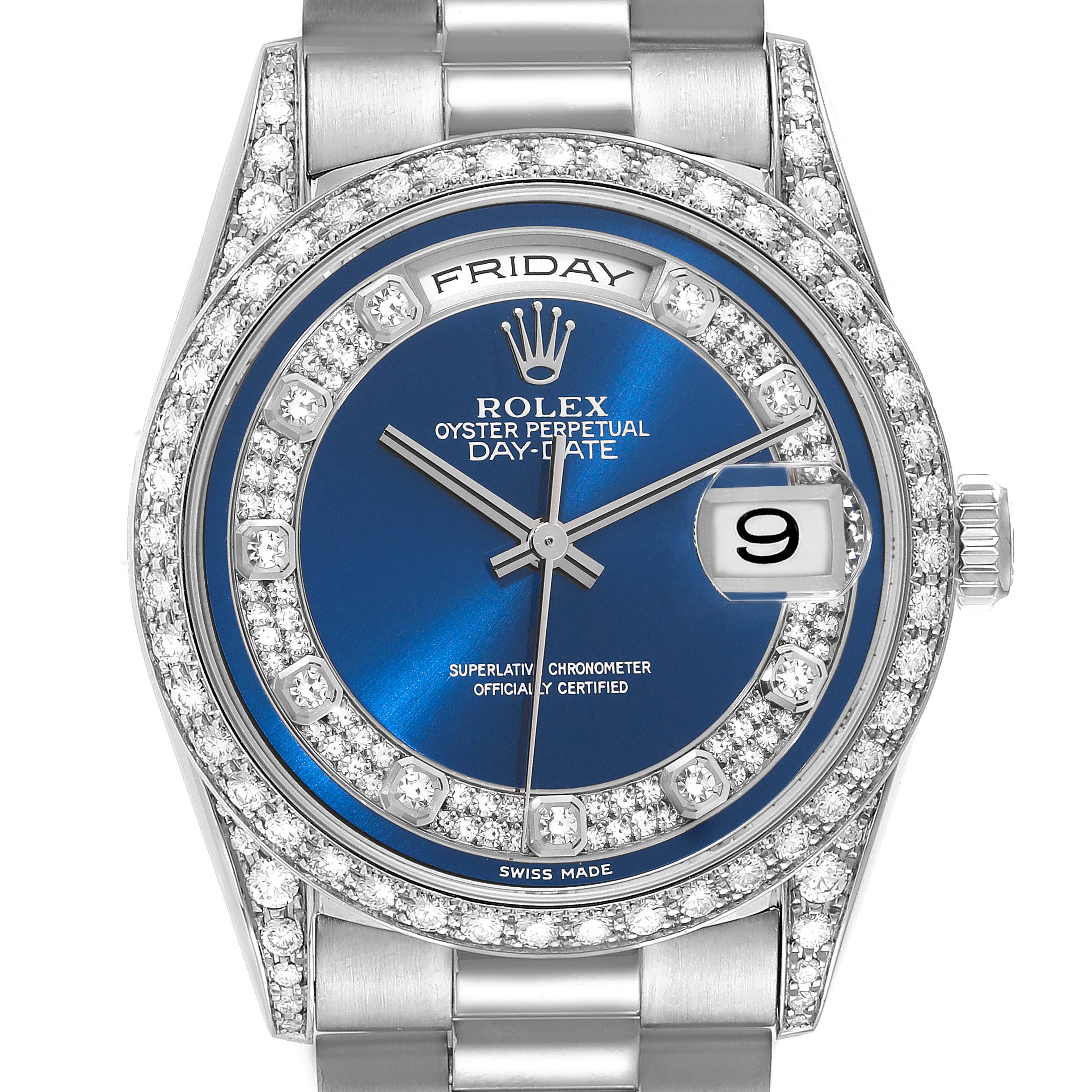 The image shows a close-up, front view of the Rolex President 18389MG Men's White Gold Blue Dial 18389MG Men's White Gold Blue Dial model watch, highlighting its blue dial, date window, and diamond bezel.