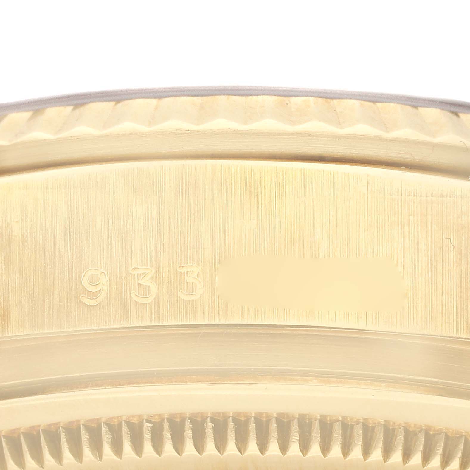 This is a close-up view of the case back of a Rolex President 18038 Men's Yellow Gold Black Dial 18038 Men's Yellow Gold Black Dial model watch, showing the engraved serial numbers.