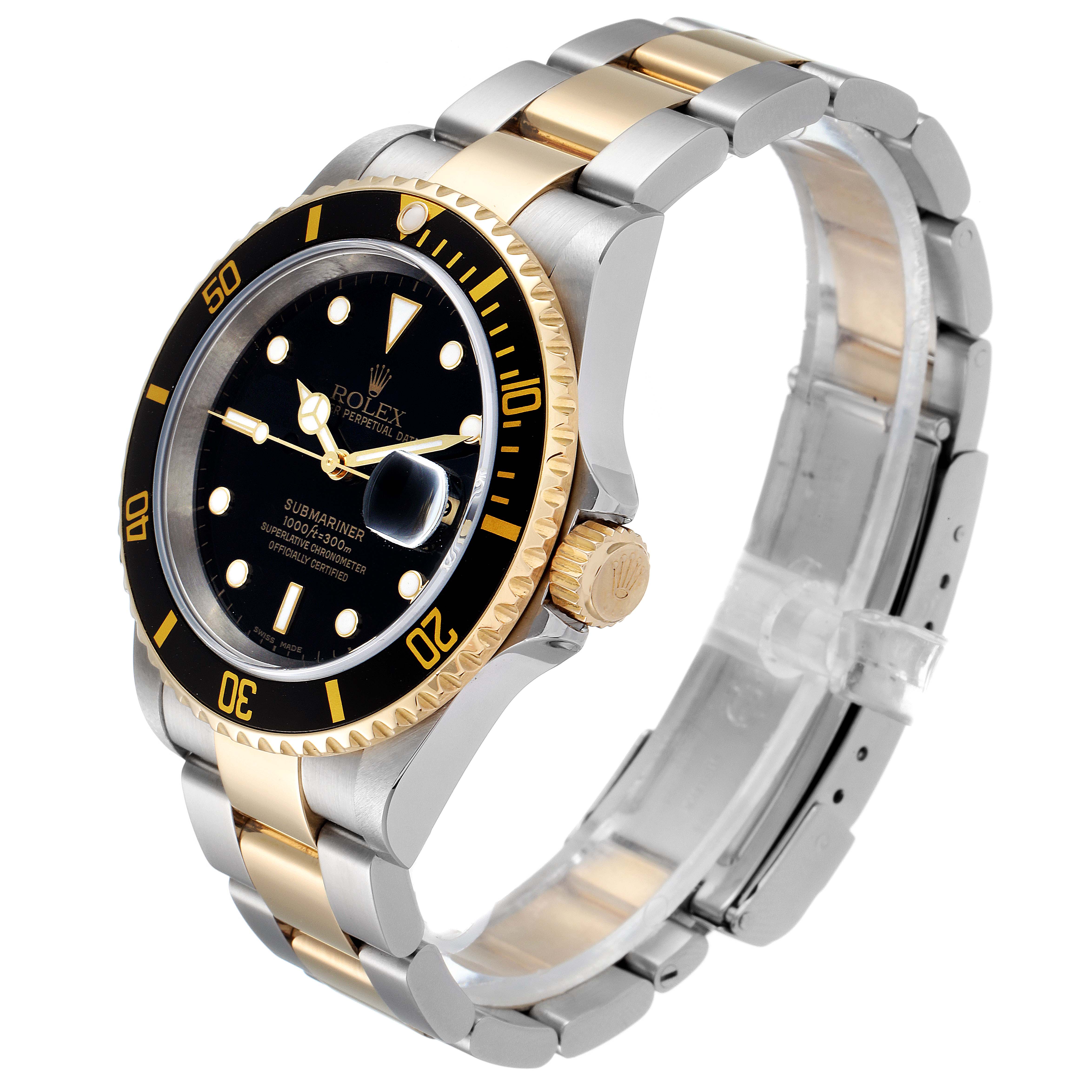 The Rolex Submariner 16613 Men's Steel and Gold (two tone) Black Dial 16613 Men's Steel and Gold (two tone) Black Dial watch is shown at a 45-degree angle, displaying its black dial, gold bezel, and two-tone metal bracelet.