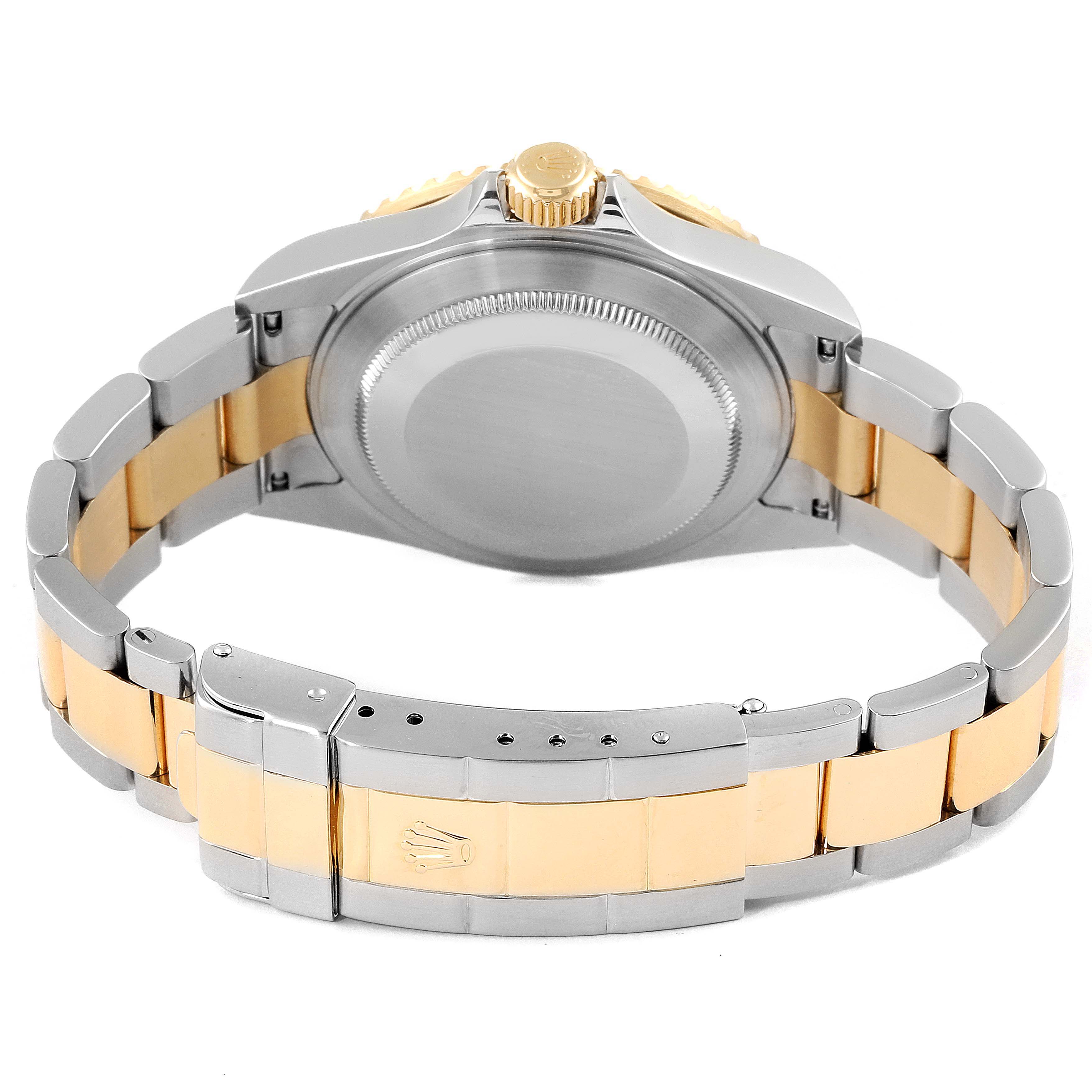 This image shows the rear view of a Rolex Submariner 16613 Men's Steel and Gold (two tone) Black Dial 16613 Men's Steel and Gold (two tone) Black Dial watch, highlighting its two-tone bracelet and back case.