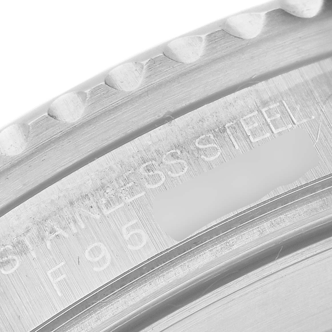 This close-up image shows the stainless steel bezel and part of the engraving on the Rolex Submariner 16610 Men
s Stainless Steel Black Dial 16610 Men
s Stainless Steel Black Dial watch.