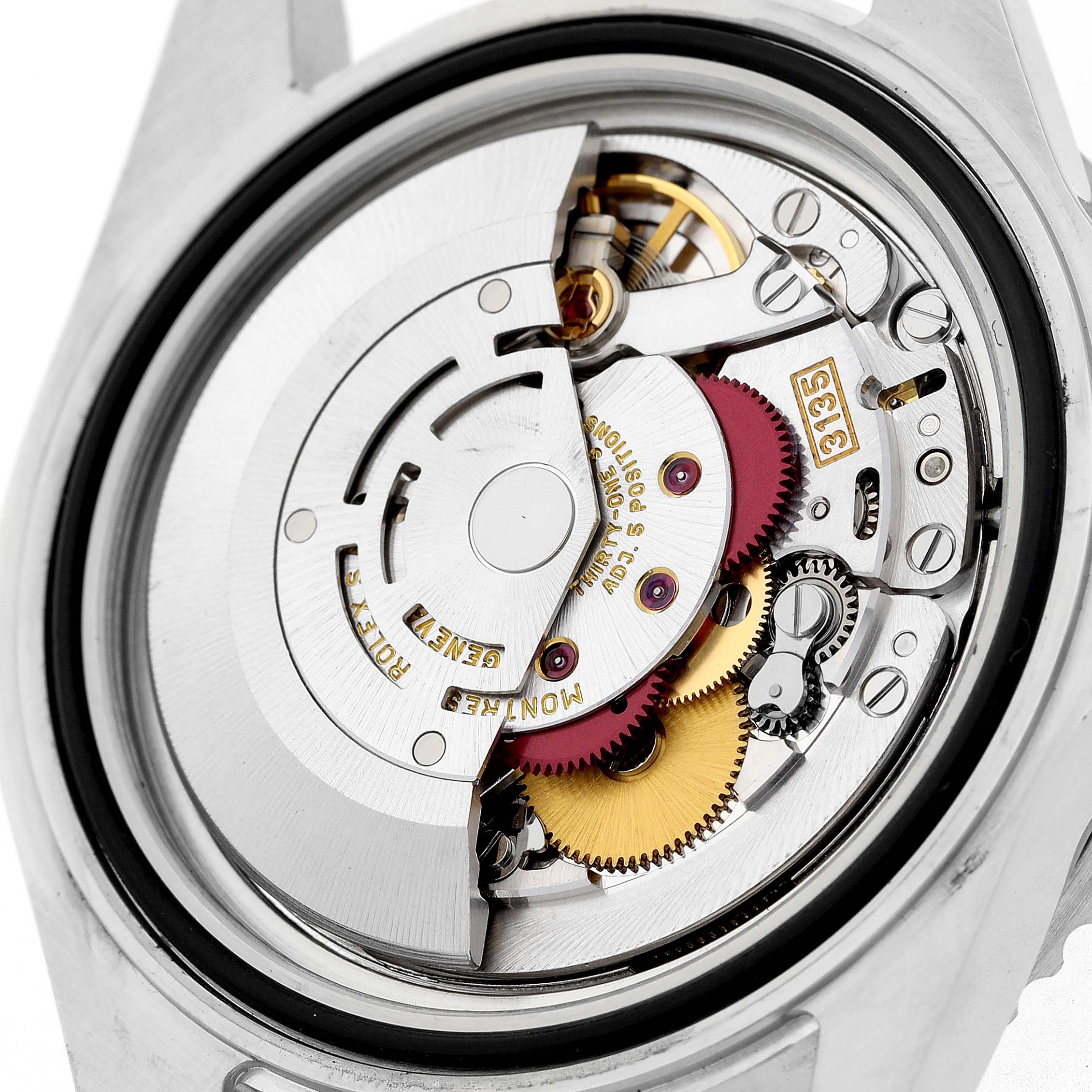 The image displays the back view of a Rolex Submariner 16610 Men's Stainless Steel Black Dial, showing its intricate internal movement components.