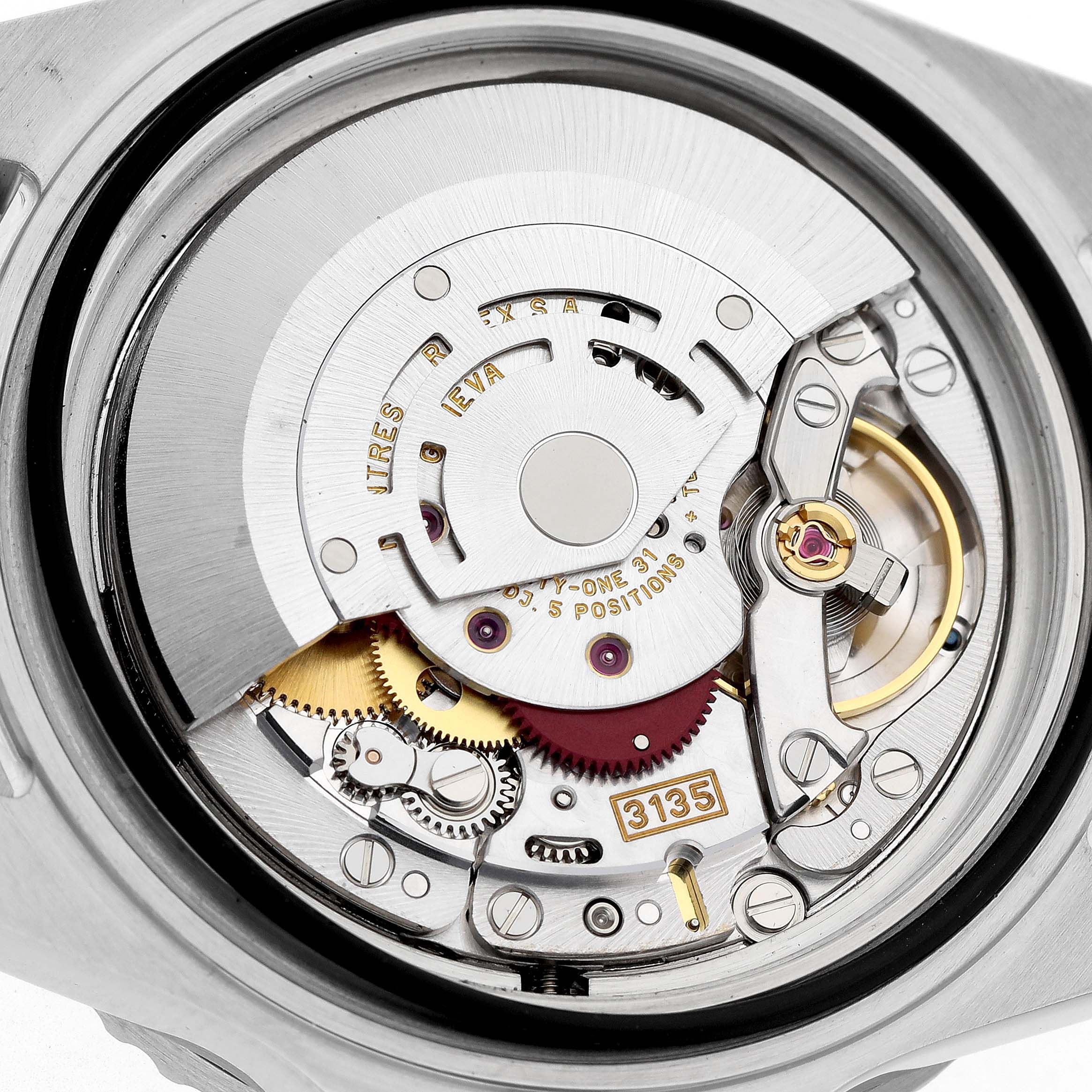The image shows the movement of a Rolex Submariner 16610 Men's Stainless Steel Black Dial watch viewed from the back, highlighting the intricate internal components.