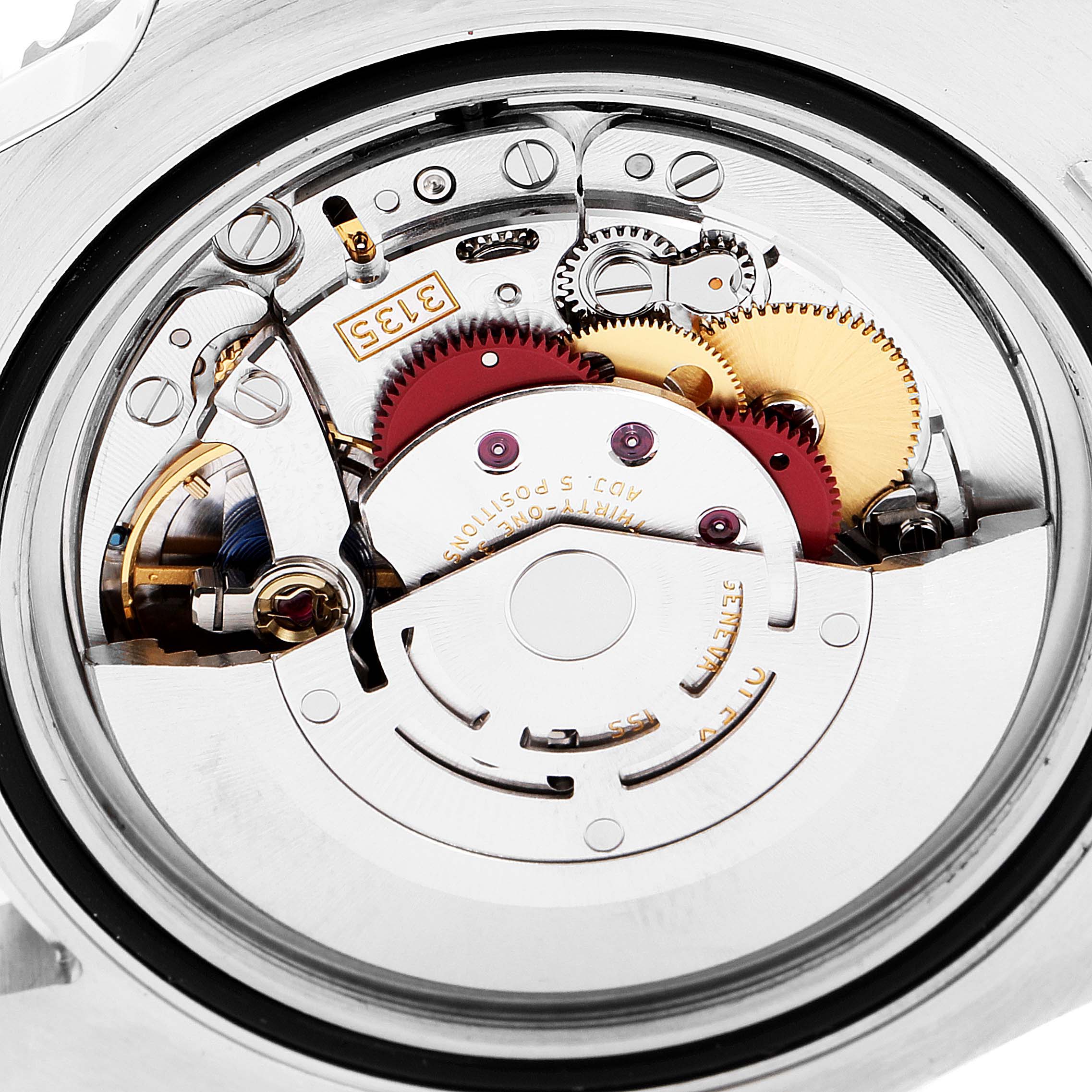The image shows a close-up view of the movement mechanism of a Rolex Submariner 116610LV Men
s Stainless Steel Green Dial 116610LV Men
s Stainless Steel Green Dial watch.