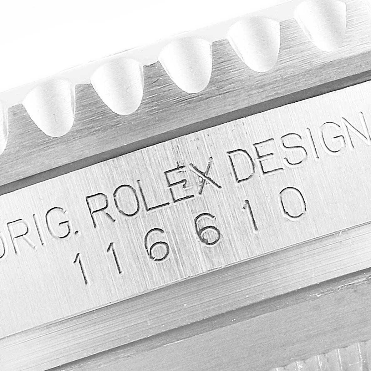 The image shows a close-up of the side engraving and bezel of a Rolex Submariner 116610LV Men
s Stainless Steel Green Dial 116610LV Men
s Stainless Steel Green Dial, model number 116610.