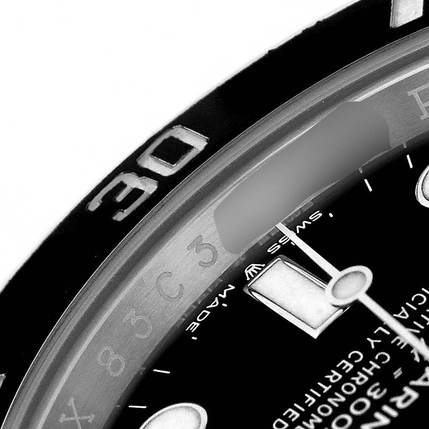 The image shows a close-up of the bezel and partial dial of the Rolex Submariner M126610LN Men's Stainless Steel Black Dial, highlighting the markers and text detail.