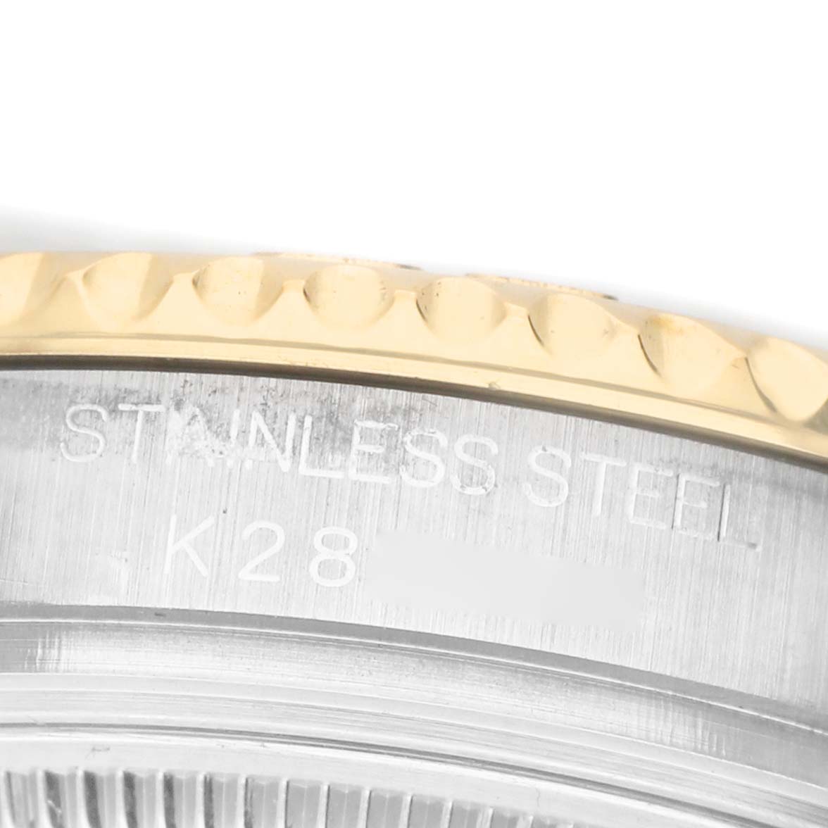 The image shows a close-up of the bezel and case back of a Rolex Yacht-Master 168623 Men's Steel and Gold (two tone) White Dial watch, highlighting the stainless steel and inscriptions.