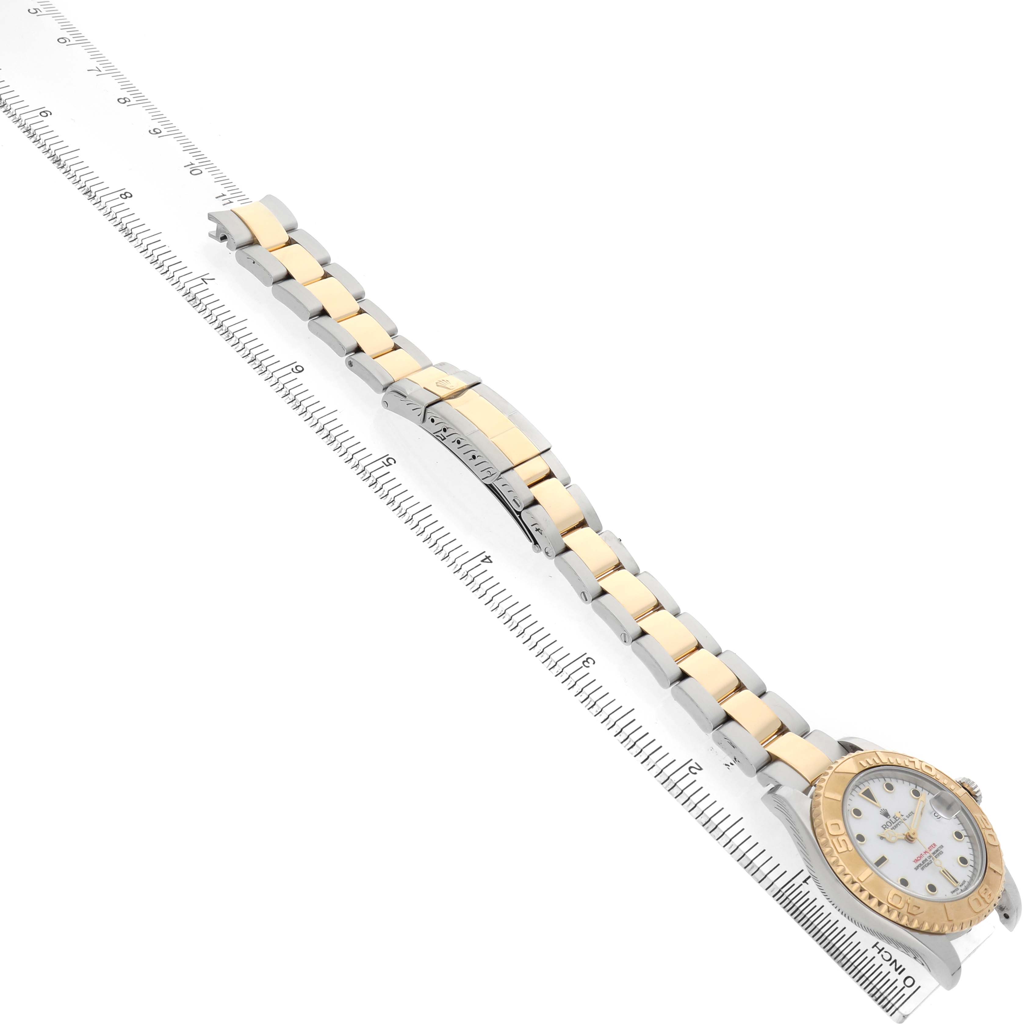 The Rolex Yacht-Master 168623 Men's Steel and Gold (two tone) White Dial watch is shown at an angle, highlighting the bracelet, clasp, and part of the bezel and face.