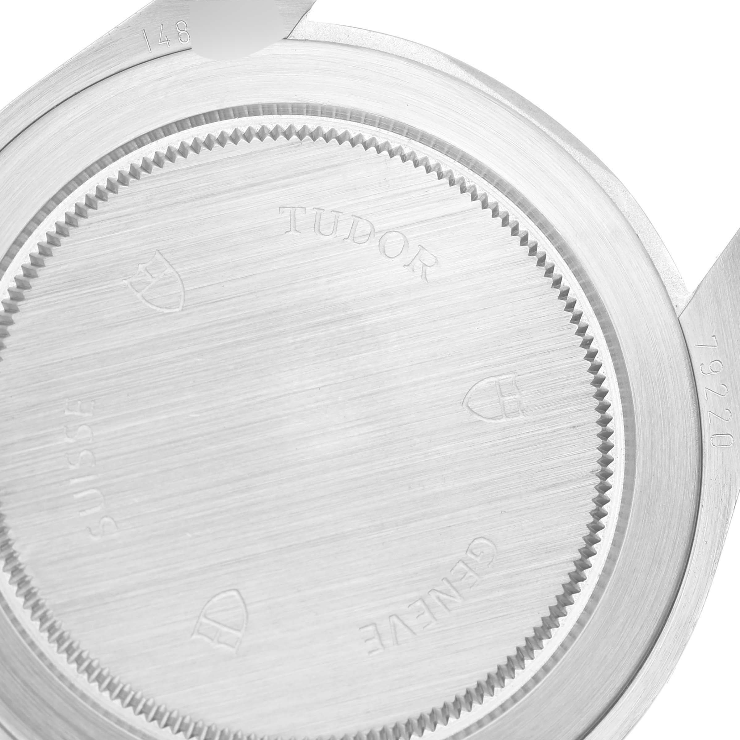 The image shows the case back of a Tudor Heritage Black Bay 79220B Men's Stainless Steel Black Dial 79220B Men's Stainless Steel Black Dial watch from a top-down angle.