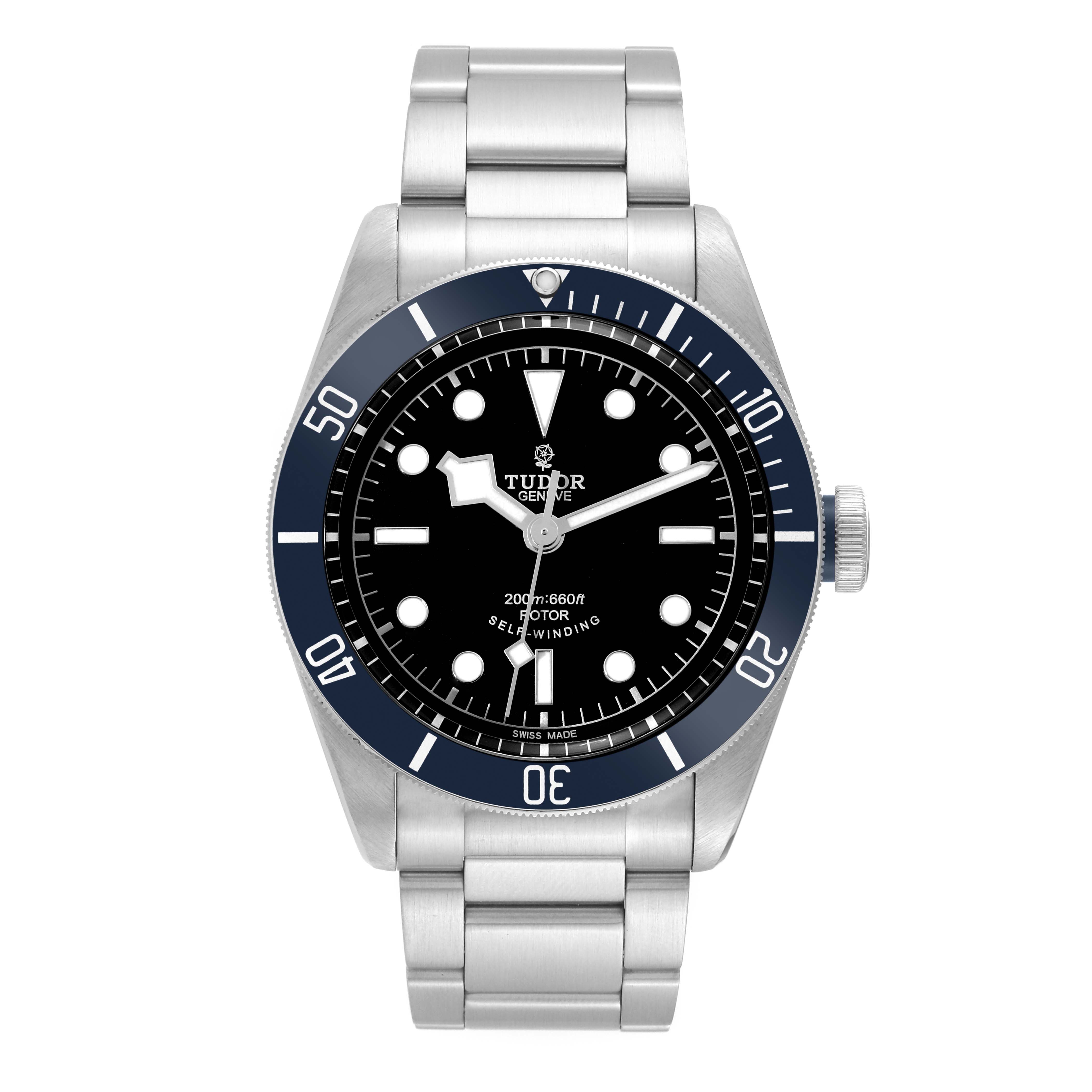 The Heritage Black Bay model by Tudor is shown from the front, displaying the dial, bezel, and stainless steel bracelet.