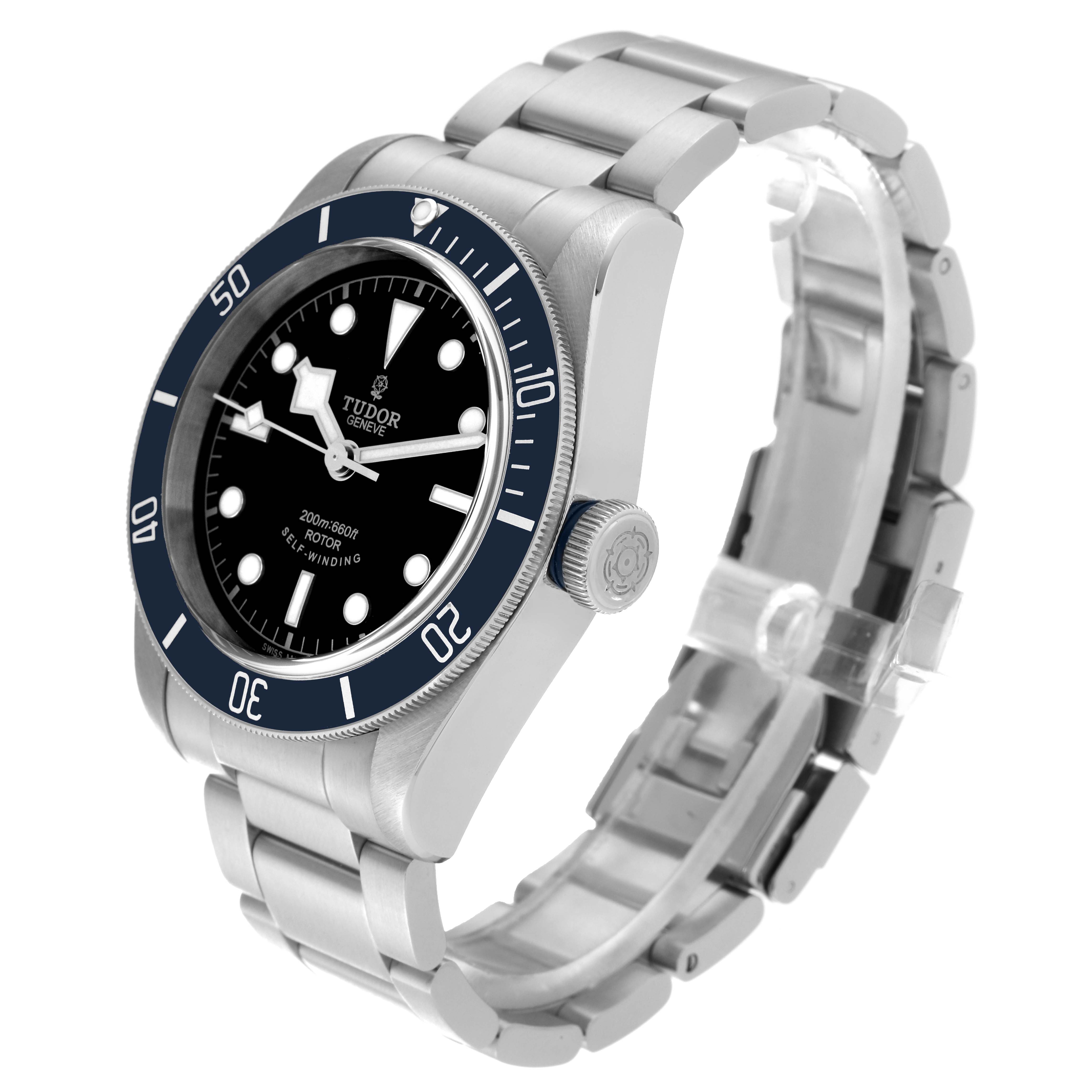 The image shows a Tudor Heritage Black Bay 79220B Men's Stainless Steel Black Dial 79220B Men's Stainless Steel Black Dial watch from a three-quarter angle, highlighting the dial, bezel, crown, and bracelet.