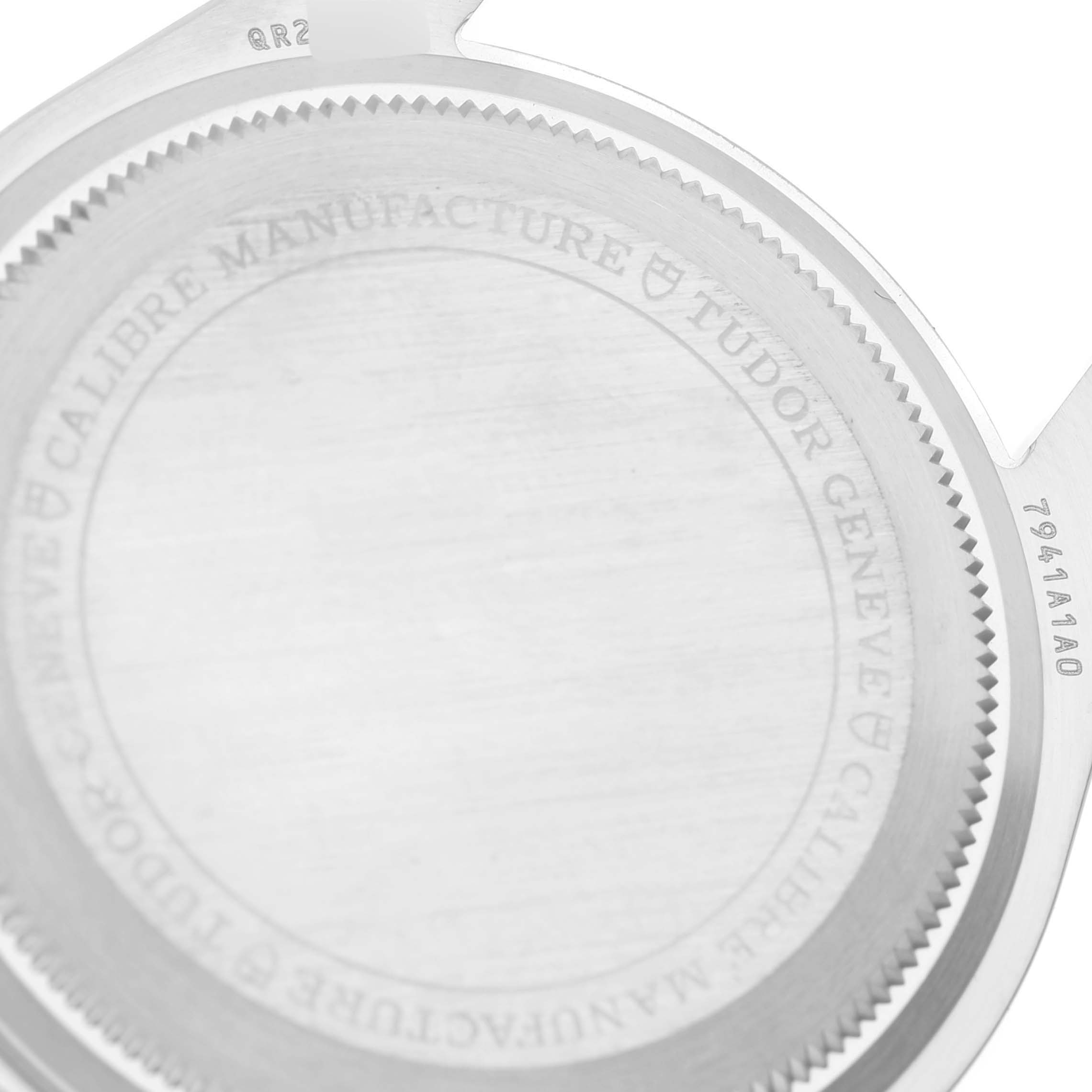 The image shows the case back of the Tudor Heritage Black Bay 7941A1A0RU Men
s Stainless Steel Black Dial 7941A1A0RU Men
s Stainless Steel Black Dial watch, featuring engraved text around the perimeter.