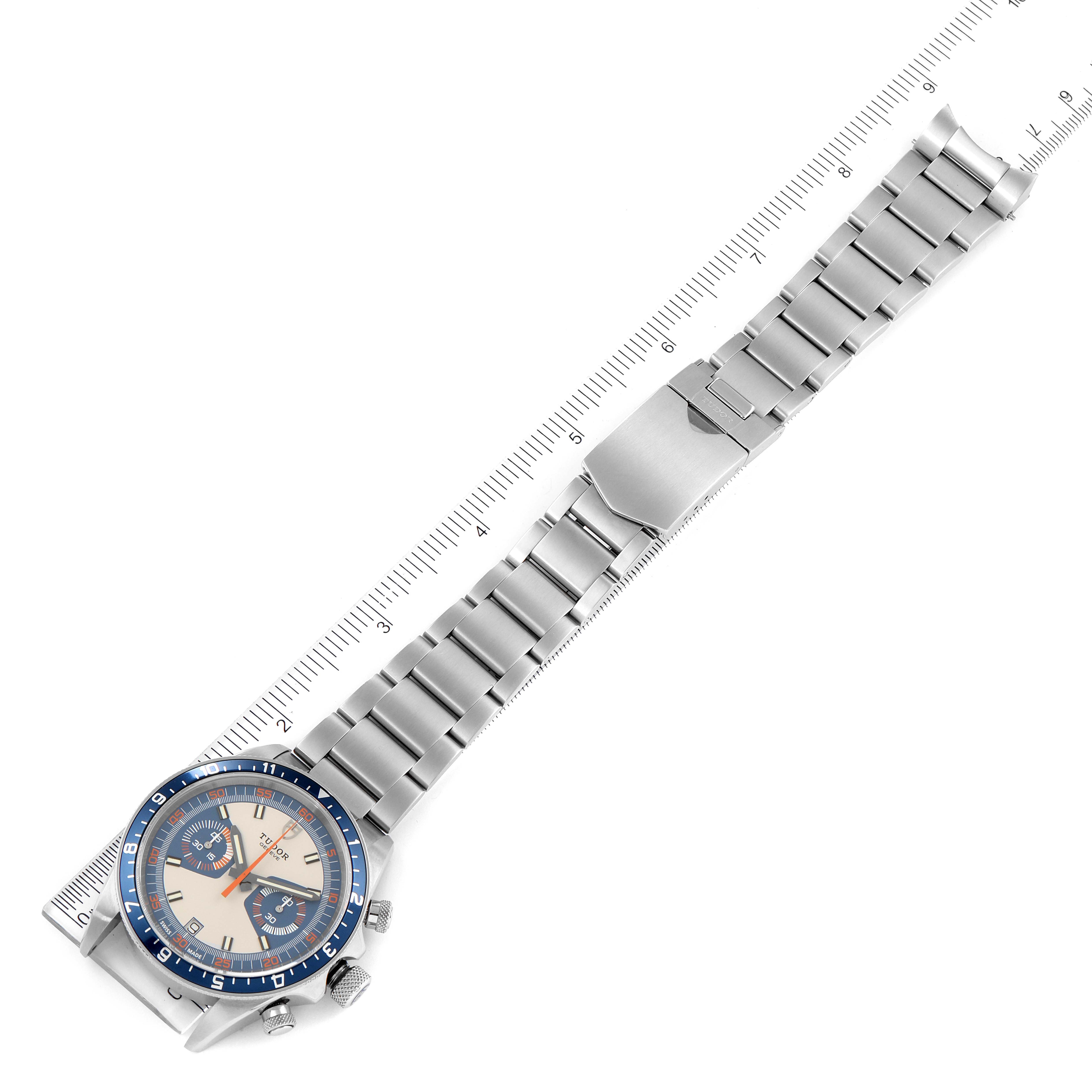 The image shows a Tudor Heritage Chrono 70330B Men's Stainless Steel Blue Dial 70330B Men's Stainless Steel Blue Dial watch laid flat, featuring the full bracelet and clasp, along with the face and bezel at an angle.