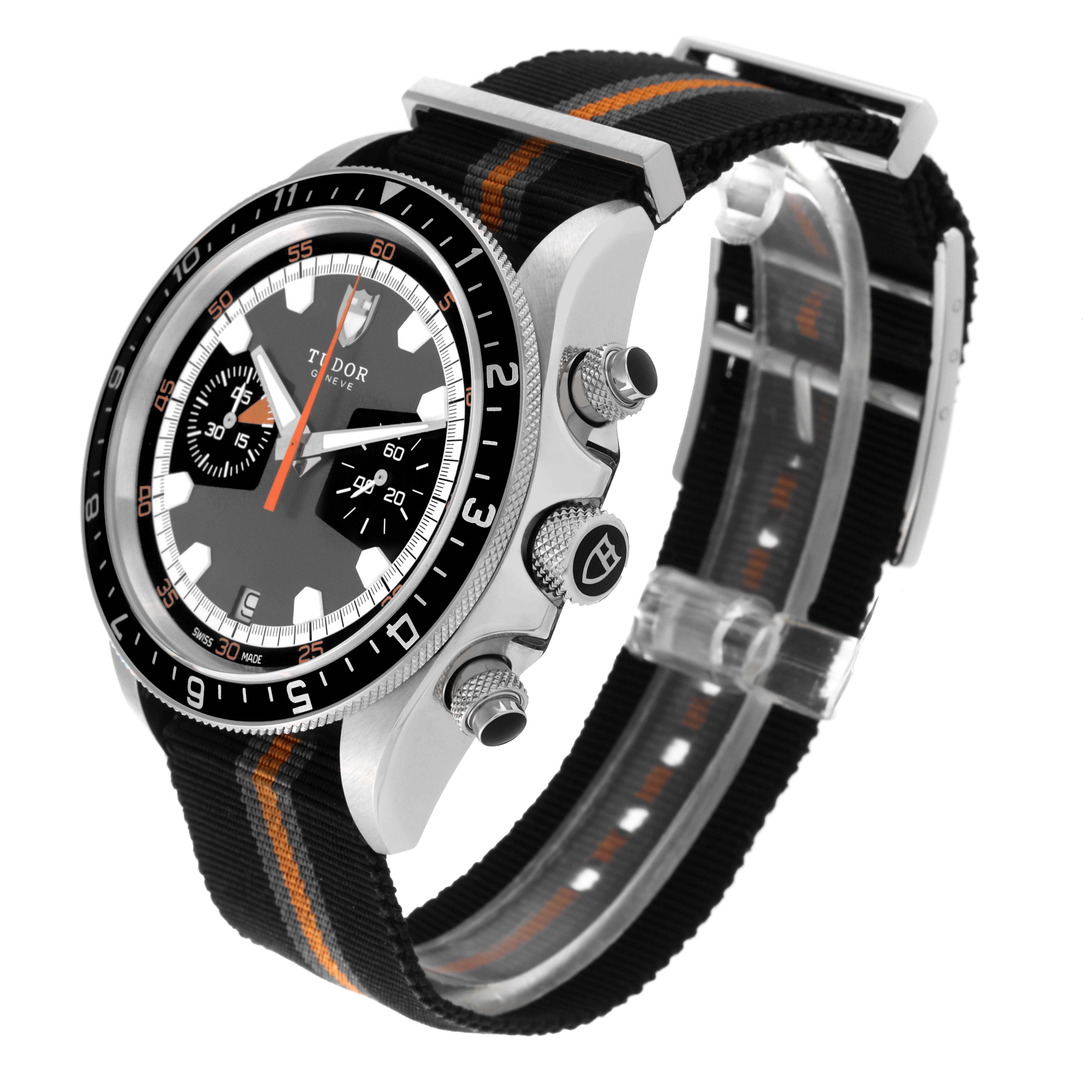 The Tudor Heritage Chrono 70330N Men
s Stainless Steel Grey Dial 70330N Men
s Stainless Steel Grey Dial watch is shown at a three-quarter angle, highlighting the bezel, crown, pushers, and NATO strap.