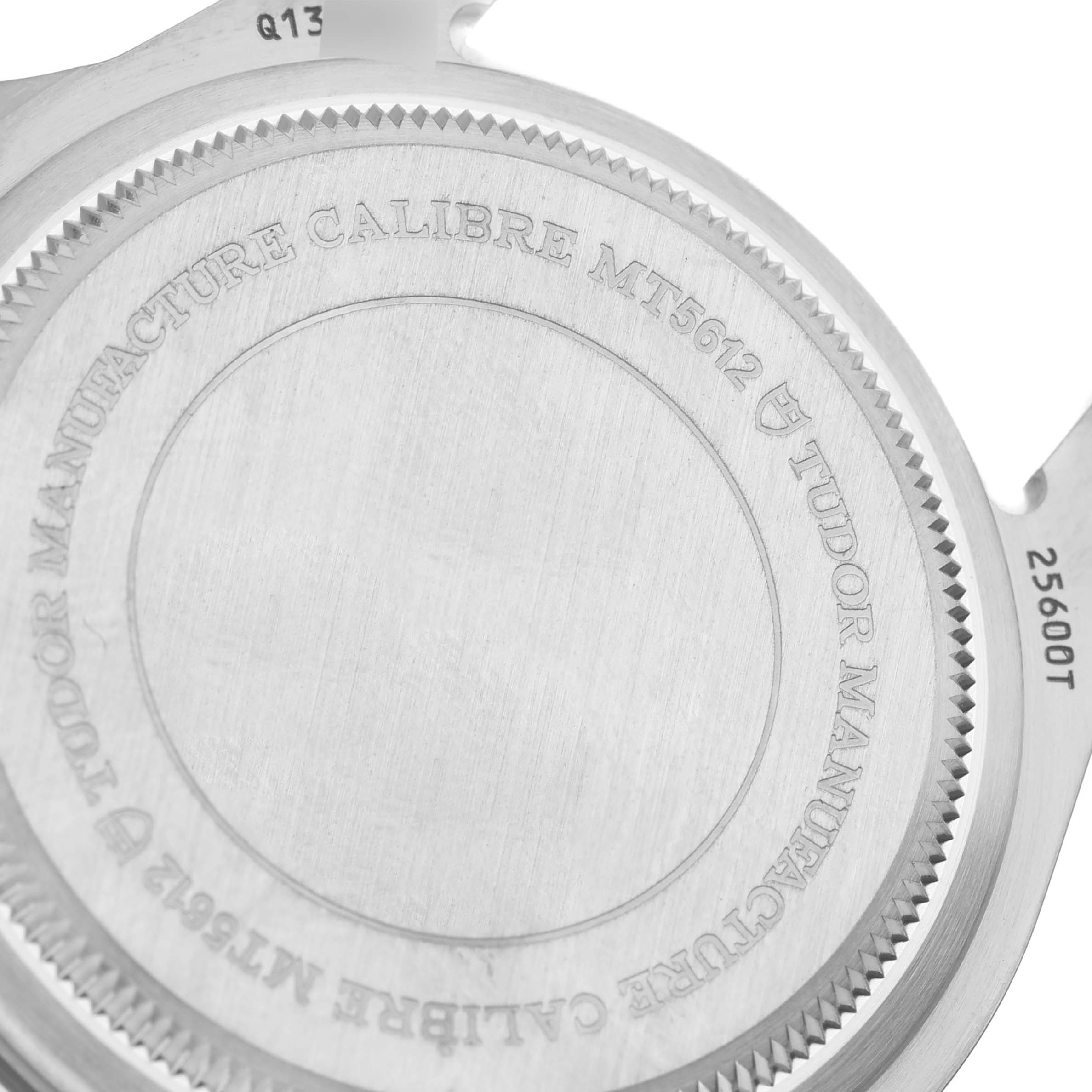 The image shows the case back of a Tudor Pelagos 25600TN Men
s Titanium Black Dial 25600TN Men
s Titanium Black Dial watch, displaying the model
s specifications and the brand
s engraving.