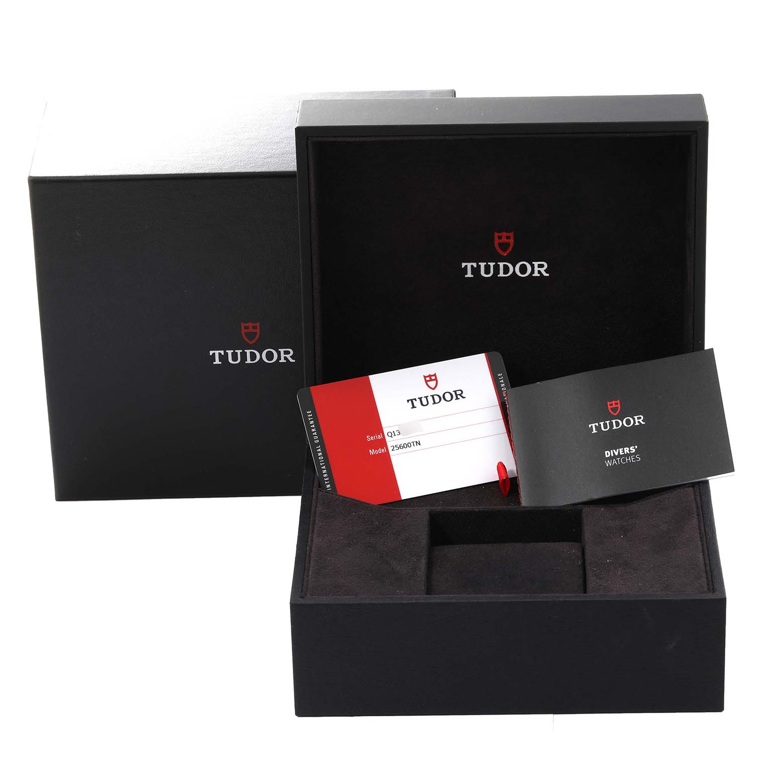 The image shows the open box and warranty card for a Tudor Pelagos 25600TN Men
s Titanium Black Dial 25600TN Men
s Titanium Black Dial watch.