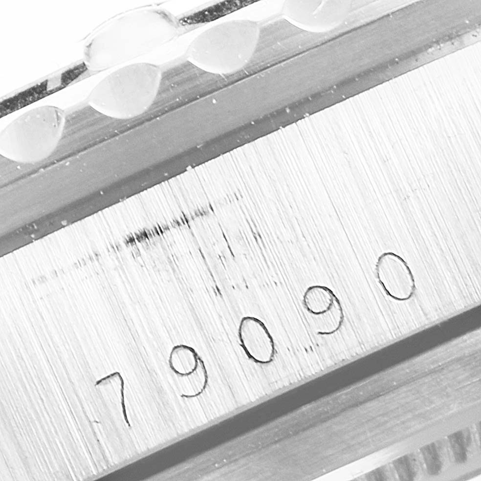 The image shows a close-up of the serial number "79090" on the case of a Tudor Submariner 79090 Men's Stainless Steel Black Dial 79090 Men's Stainless Steel Black Dial watch.