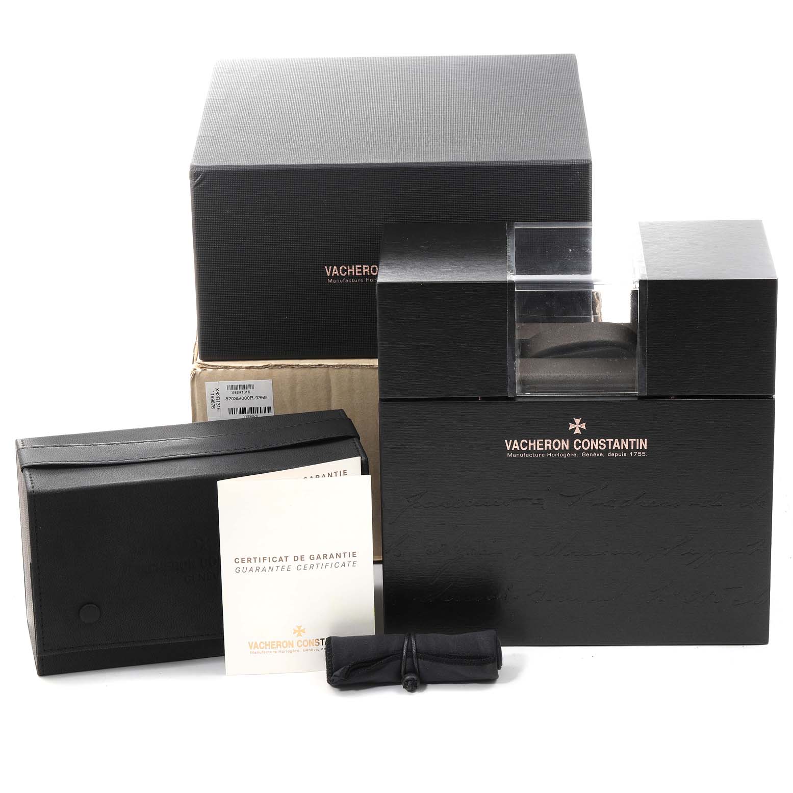 The image shows packaging and accessories for a Vacheron Constantin Overseas 49150/B01R-9454 Men's Rose Gold Silver Dial 49150/B01R-9454 Men's Rose Gold Silver Dial watch, including boxes, a certificate, and a pouch.