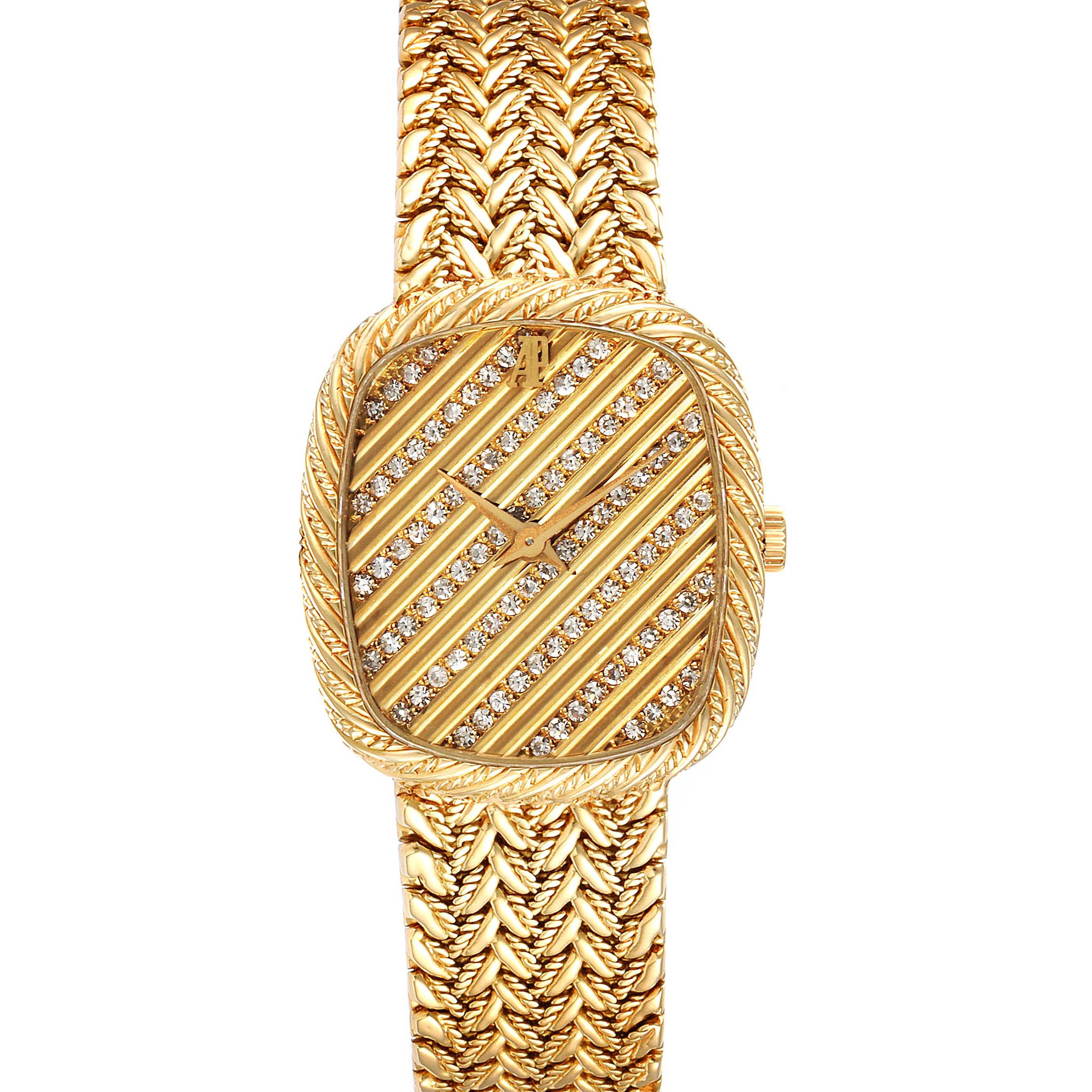 This image showcases a frontal view of a vintage Audemars Piguet watch with a gold bracelet and a gem-encrusted dial.