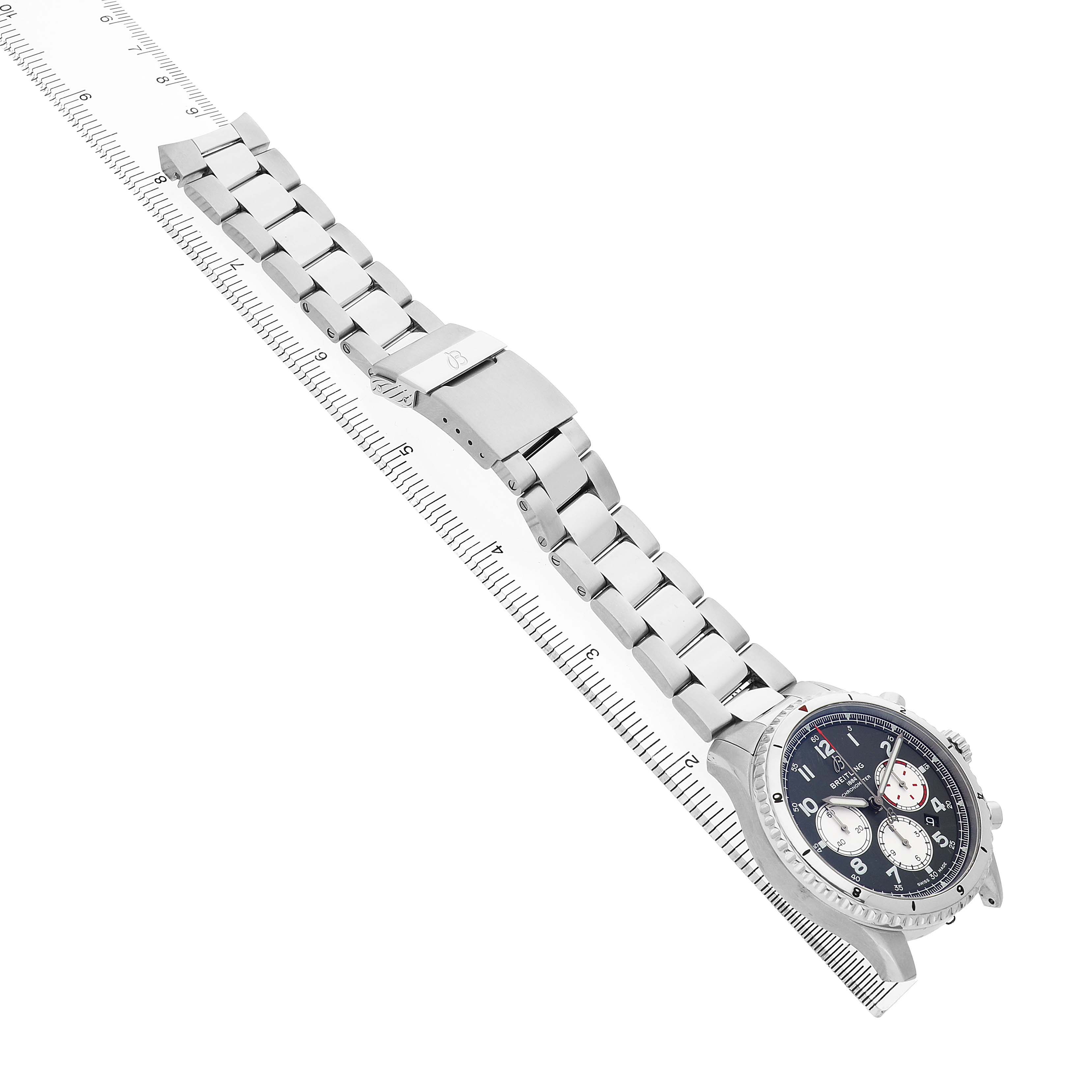 The image shows the Breitling Aviator AB01192A1L1A1 Men's Stainless Steel Green Dial watch at a diagonal angle, highlighting its full bracelet, clasp, and detailed watch face.
