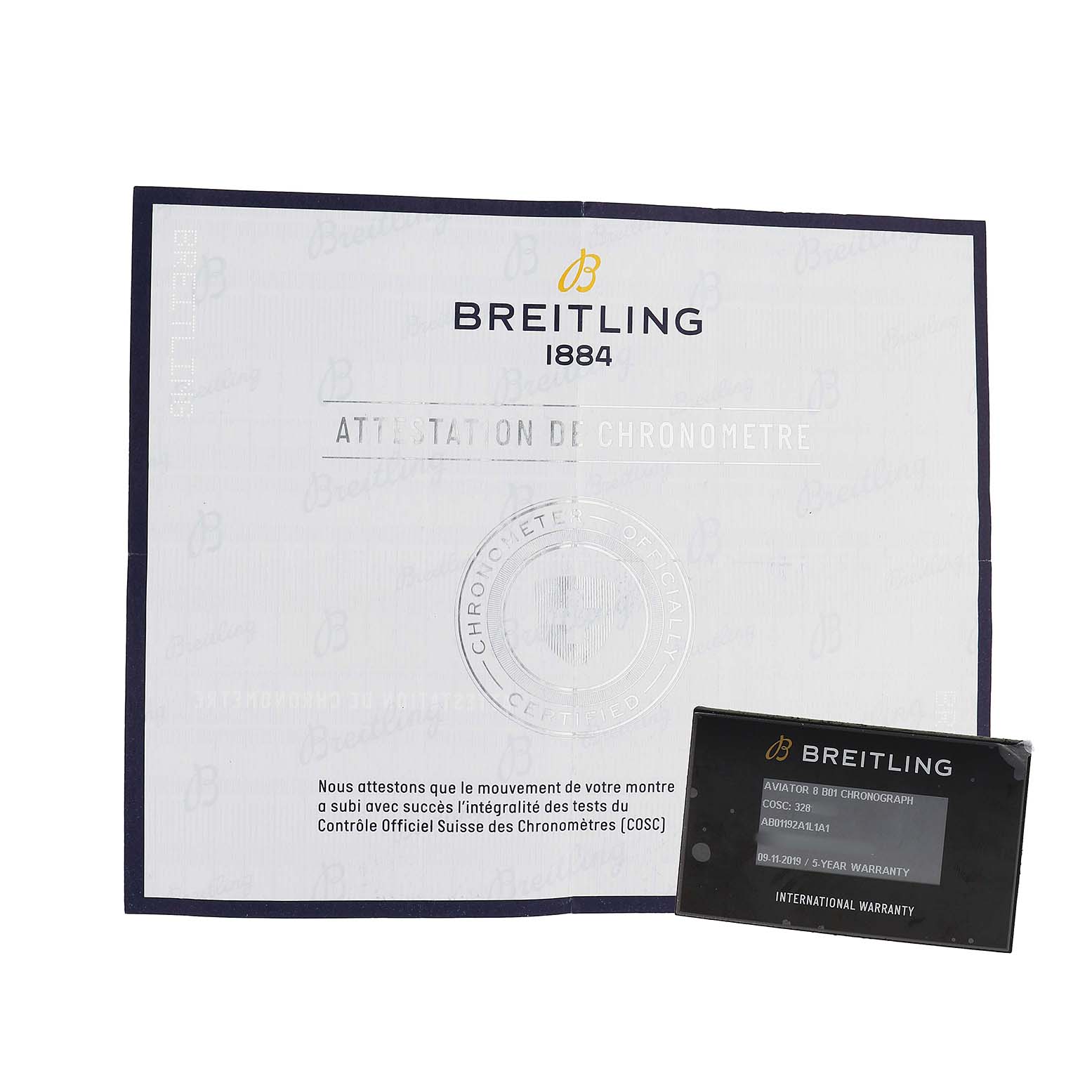 The image shows the documentation and warranty cards for the Breitling Aviator AB01192A1L1A1 Men's Stainless Steel Green Dial model.