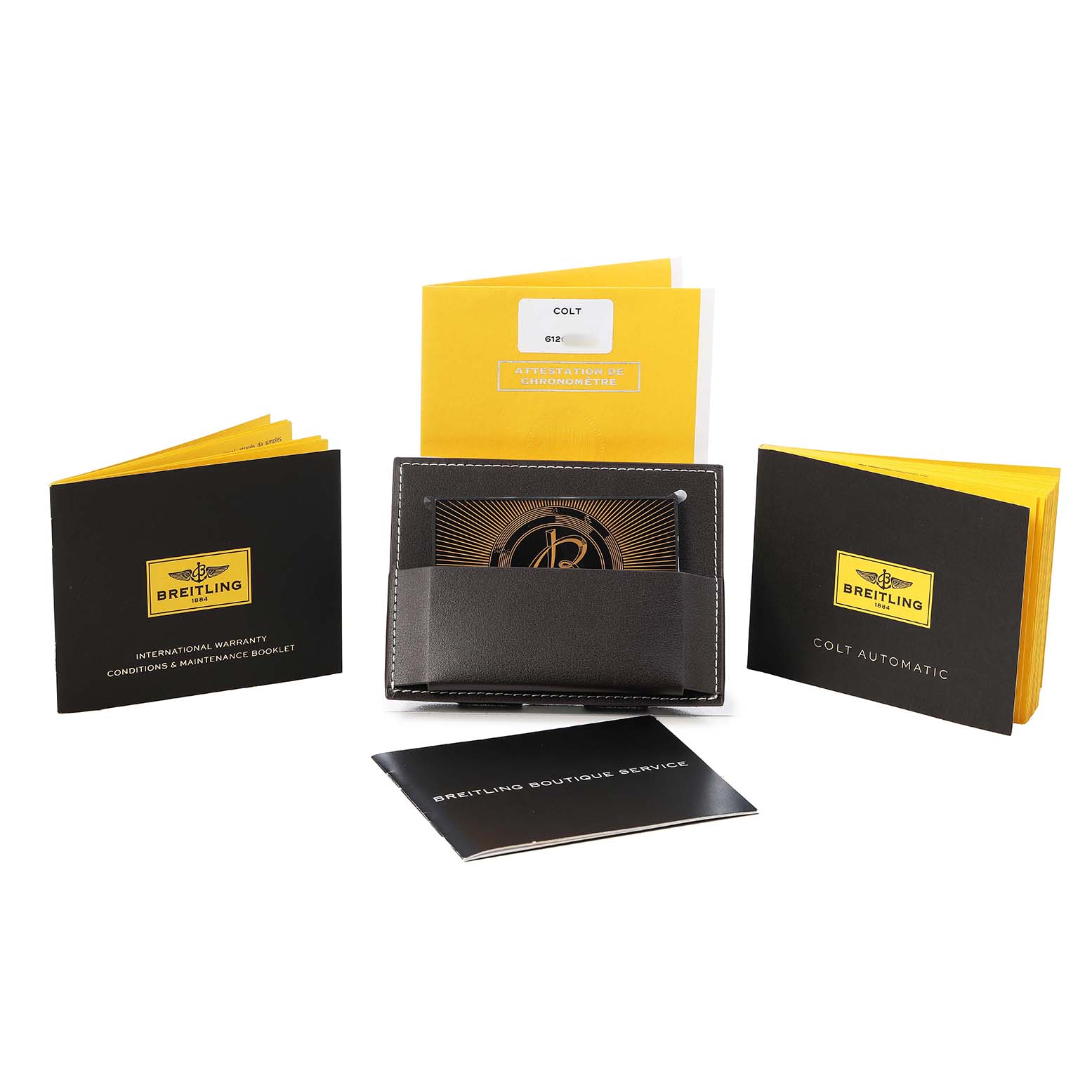 The image shows booklets and a card holder for the Breitling Colt A1738811/BD44 Men's Stainless Steel Black Dial, including warranty and service documents.