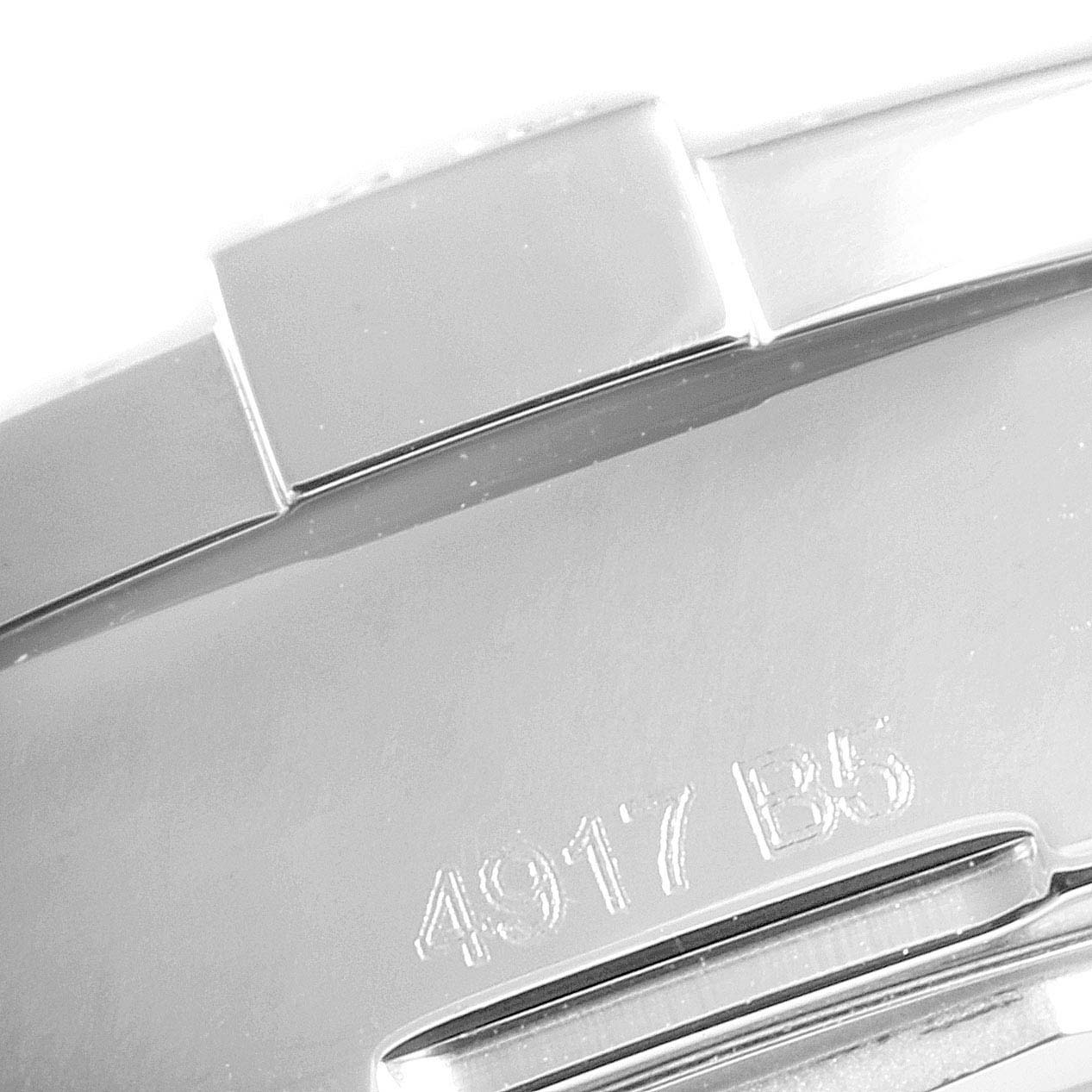 This close-up image shows the polished back and part of the bracelet of a Breitling Colt A17388 Men's Stainless Steel Blue Dial A17388 Men's Stainless Steel Blue Dial watch, with the model number "4917 B5" engraved.