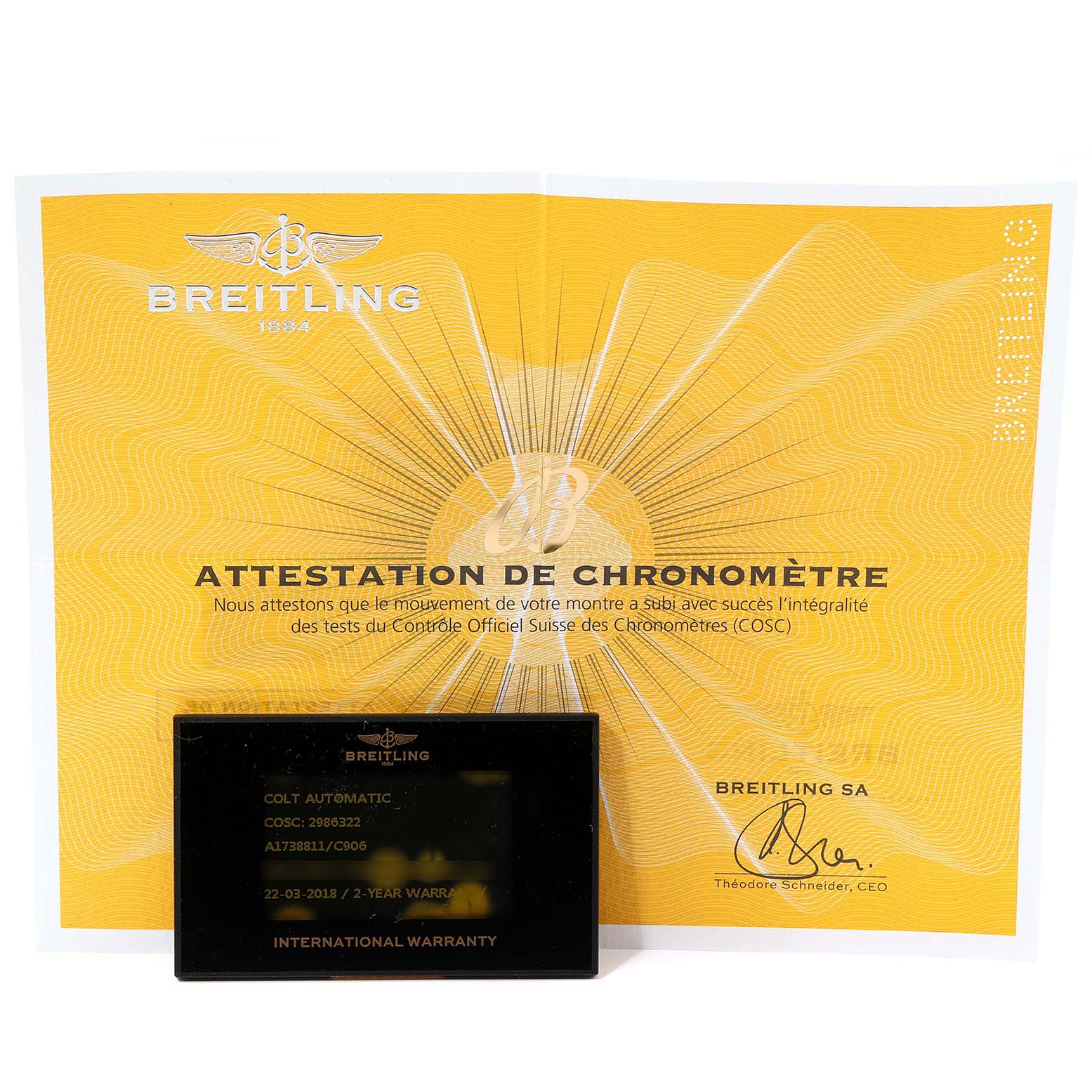 The image shows the serial number card and chronometer certificate for the Colt model by Breitling.