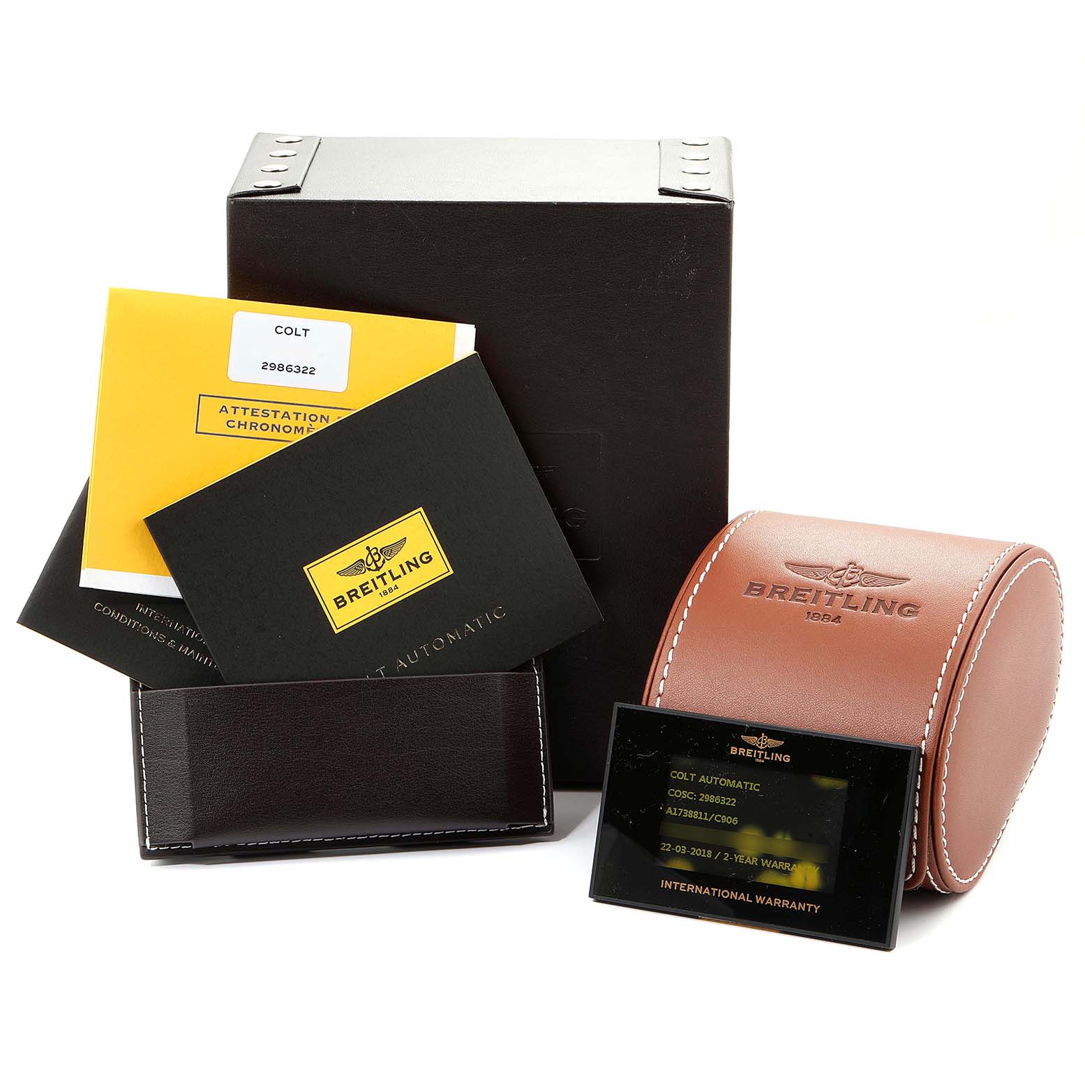 The image shows the Breitling Colt A17388 Men's Stainless Steel Blue Dial A17388 Men's Stainless Steel Blue Dial watch accessories, including a box, warranty card, manuals, and a travel case.