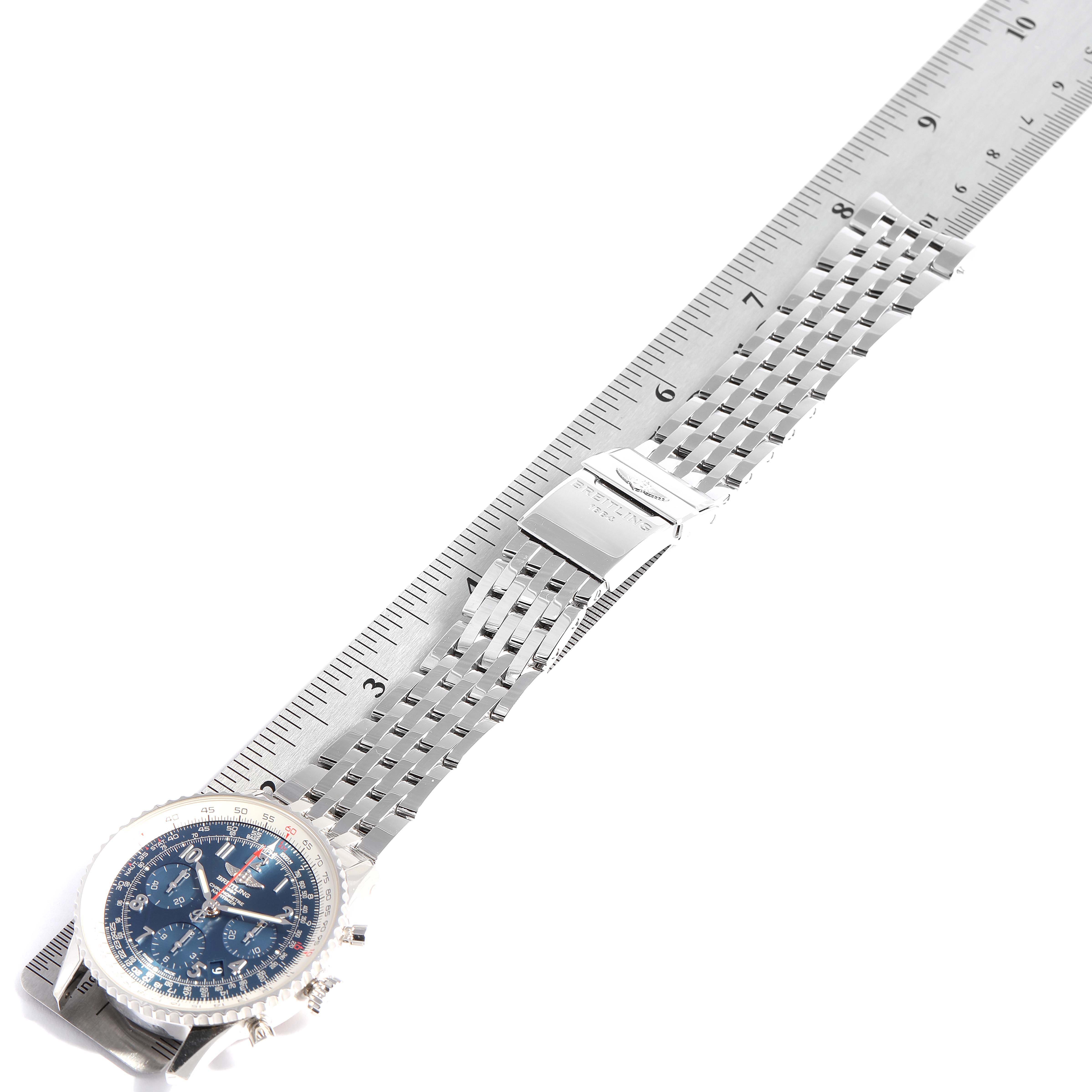 The image shows a top view of a Breitling Navitimer AB0121C4-C920-447A Men
s Stainless Steel Blue Dial AB0121C4-C920-447A Men
s Stainless Steel Blue Dial watch, displaying the dial, case, and metal bracelet against a ruler for scale.
