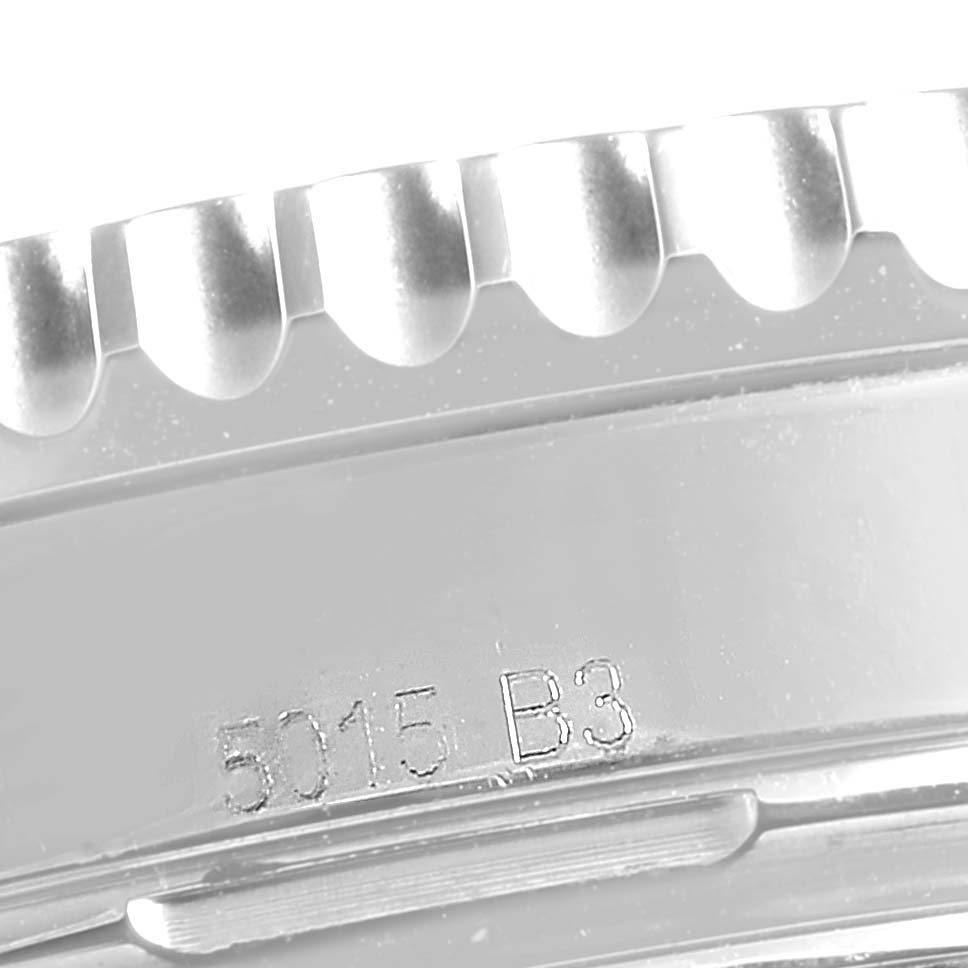 This close-up image shows the side of the bezel and case of a Breitling Navitimer AB0121C4-C920-447A Men
s Stainless Steel Blue Dial AB0121C4-C920-447A Men
s Stainless Steel Blue Dial watch, including serial numbers.