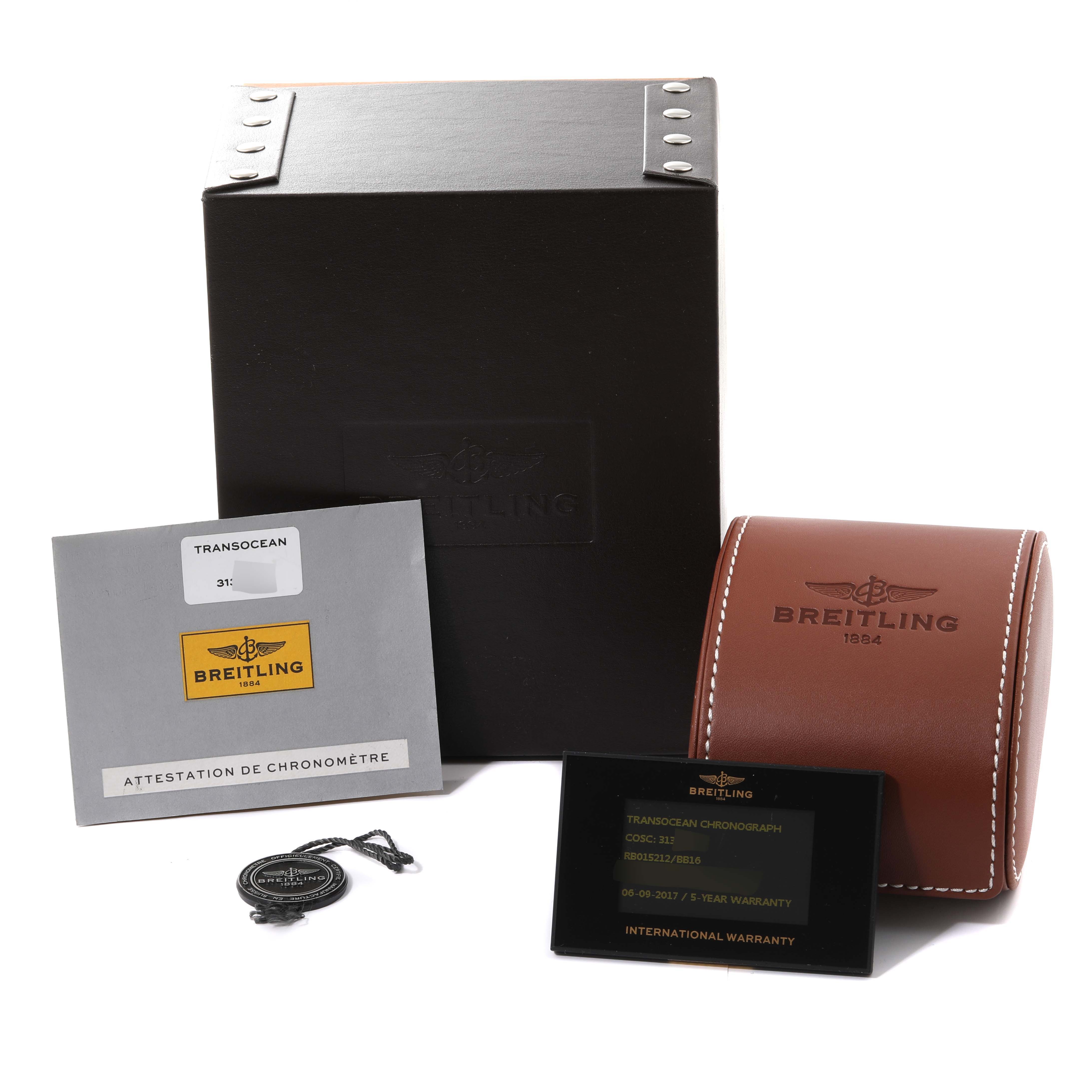 This image shows the Breitling Transocean RB0152 Men
s Rose Gold Black Dial RB0152 Men
s Rose Gold Black Dial watch packaging, including the box, warranty card, chronometer certificate, and a leather case.
