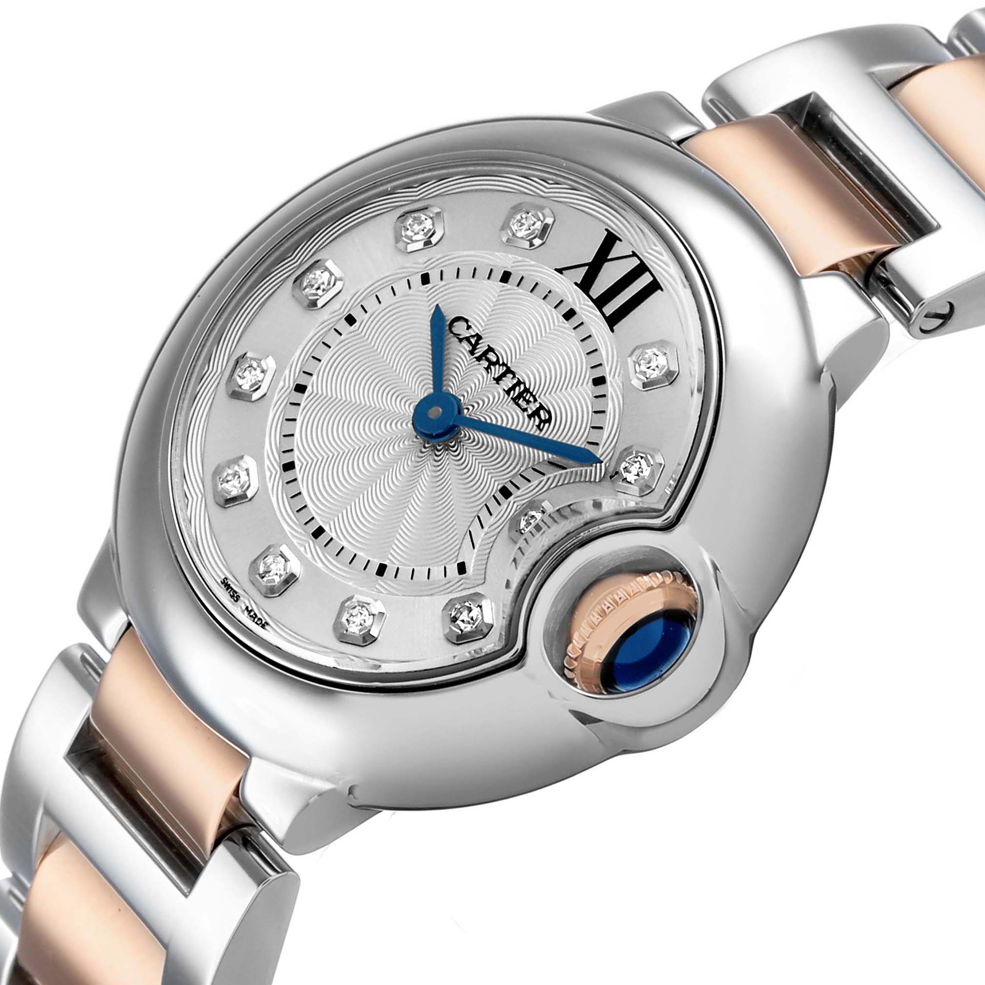 The image shows a close-up of the Cartier Ballon Bleu WE902030 Women's Steel and Gold (two tone) Silver Dial watch face, highlighting its crown, bracelet, and diamond indices.