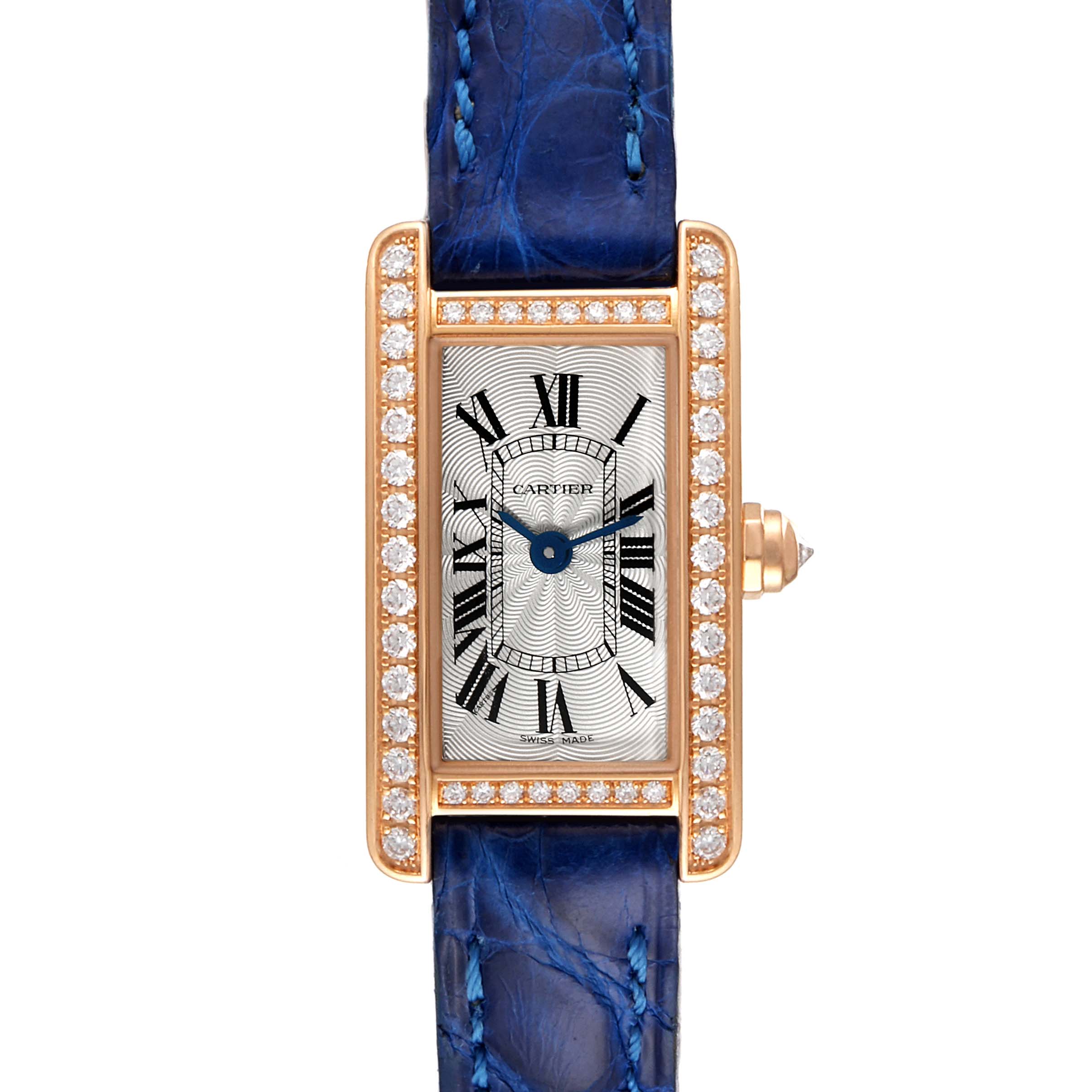 The image shows a Cartier Tank Americaine WJTA0026 Women's Rose Gold Silver Dial WJTA0026 Women's Rose Gold Silver Dial watch with a blue leather strap and diamond-encrusted rectangular case.