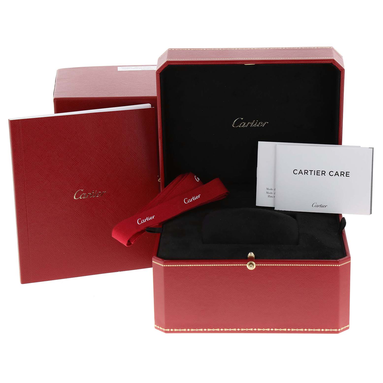 The image displays the packaging for a Cartier Tank Americaine WJTA0026 Women's Rose Gold Silver Dial WJTA0026 Women's Rose Gold Silver Dial watch, including a box, care booklets, and a strap.