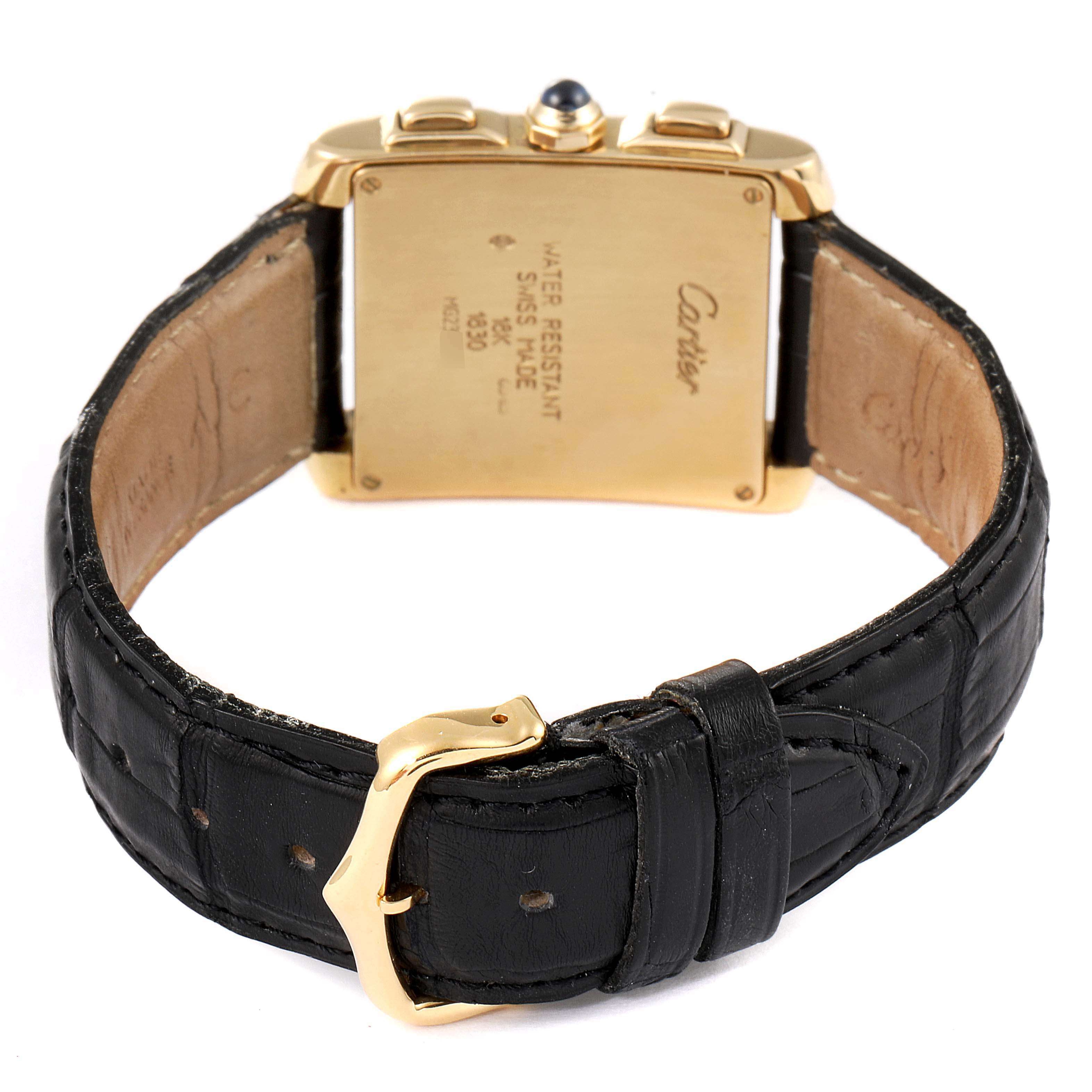 The image shows the back view of the Cartier Tank Francaise W5000556 Men's Yellow Gold Silver Dial W5000556 Men's Yellow Gold Silver Dial watch, highlighting its rectangular case, leather strap, and clasp.