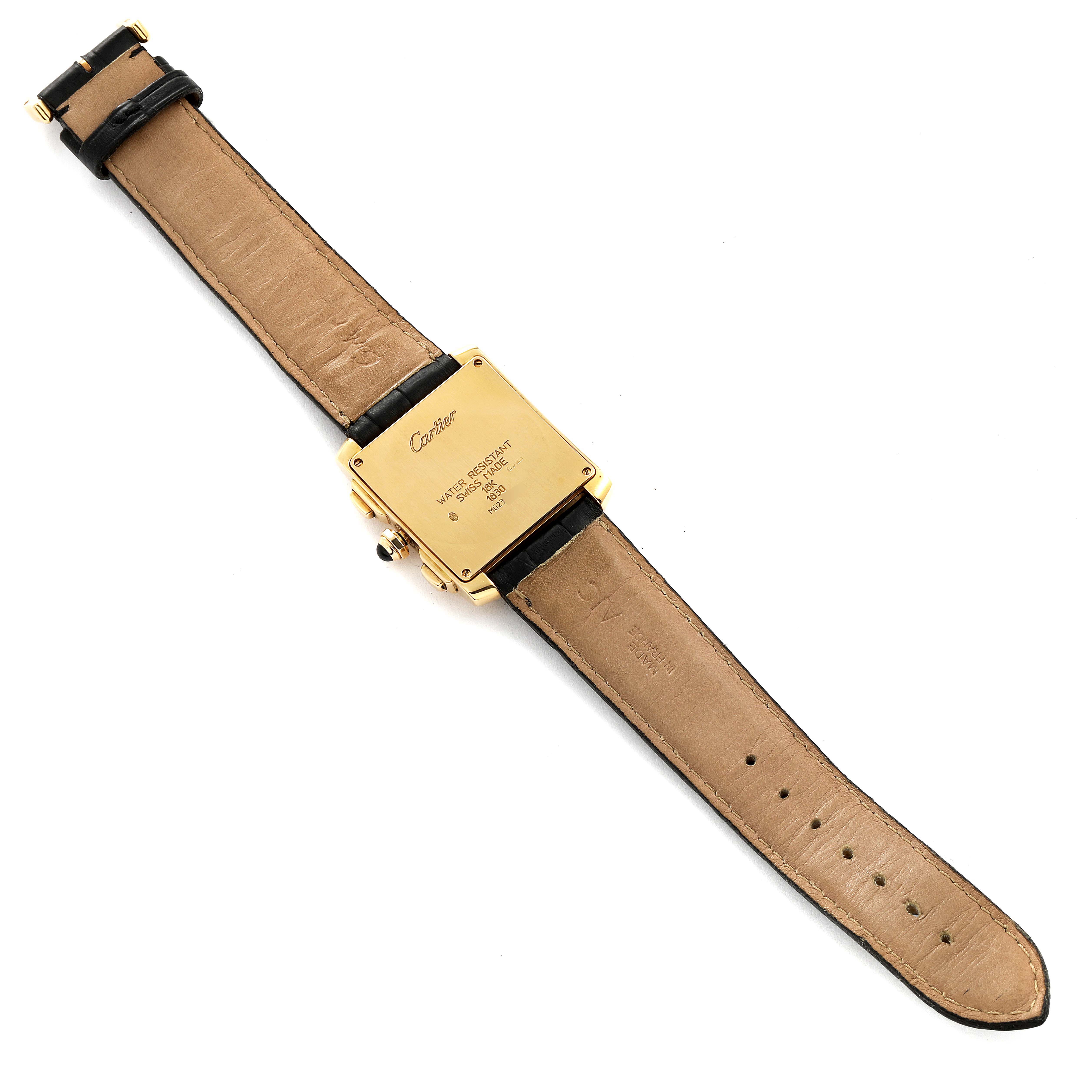 The image shows the back of a Cartier Tank Francaise W5000556 Men's Yellow Gold Silver Dial W5000556 Men's Yellow Gold Silver Dial watch, highlighting the case back and leather strap.