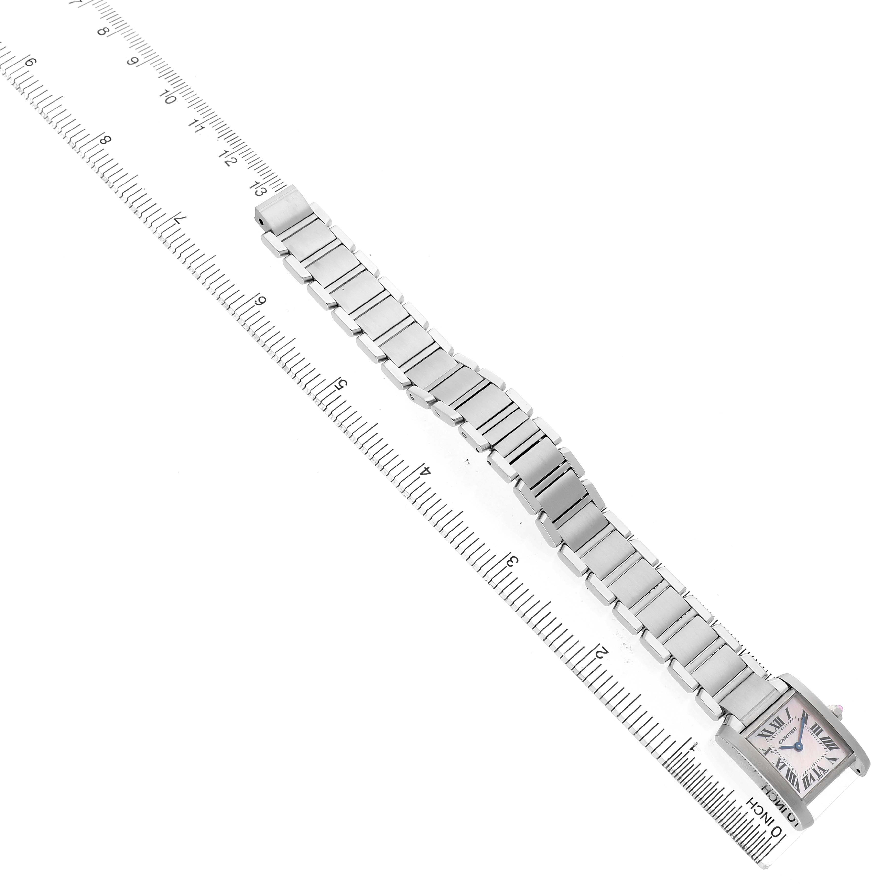 The Cartier Tank Française watch is shown diagonally, displaying its full bracelet and rectangular face with Roman numerals.