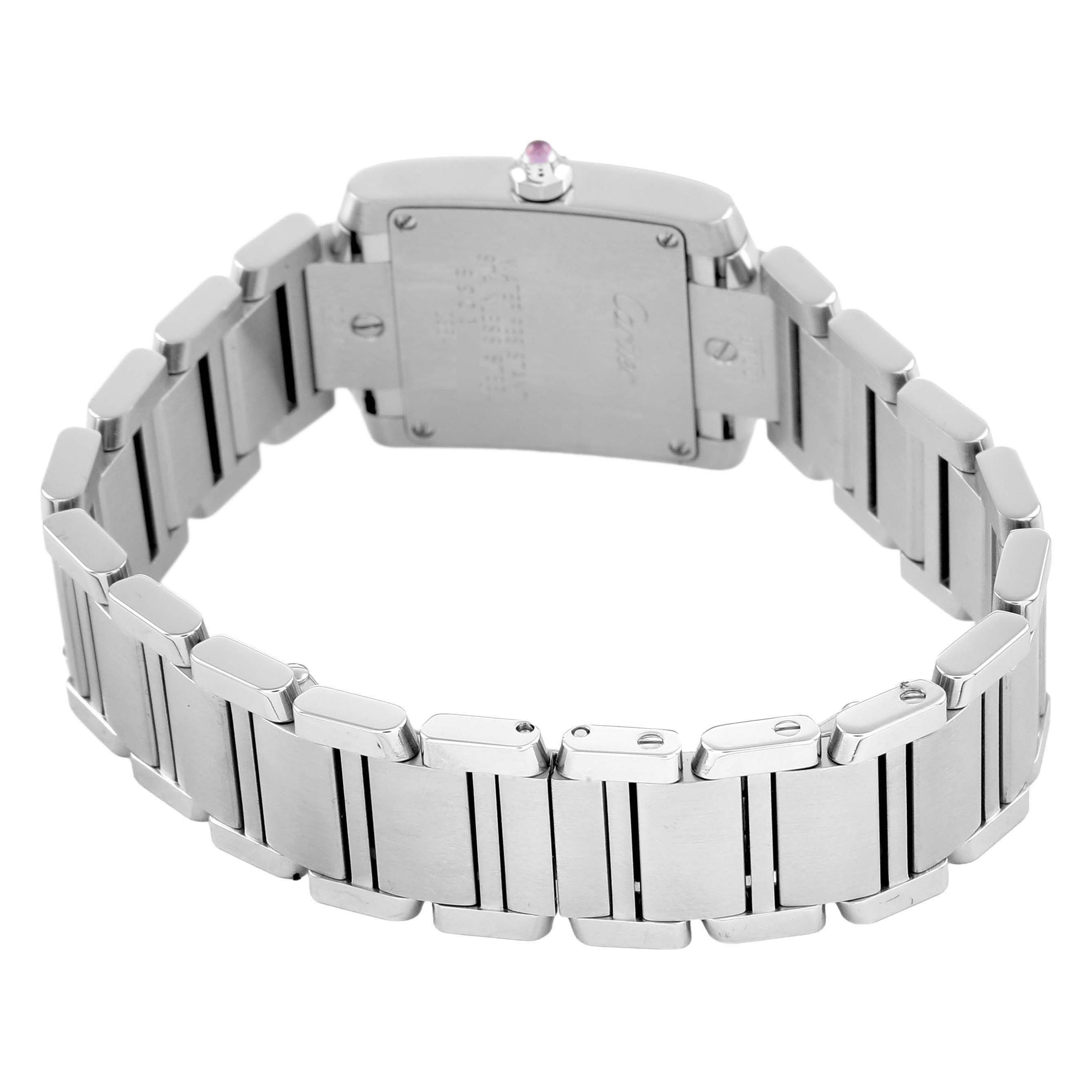 The image shows the back of a Cartier Tank Française watch, featuring its clasp and bracelet links.