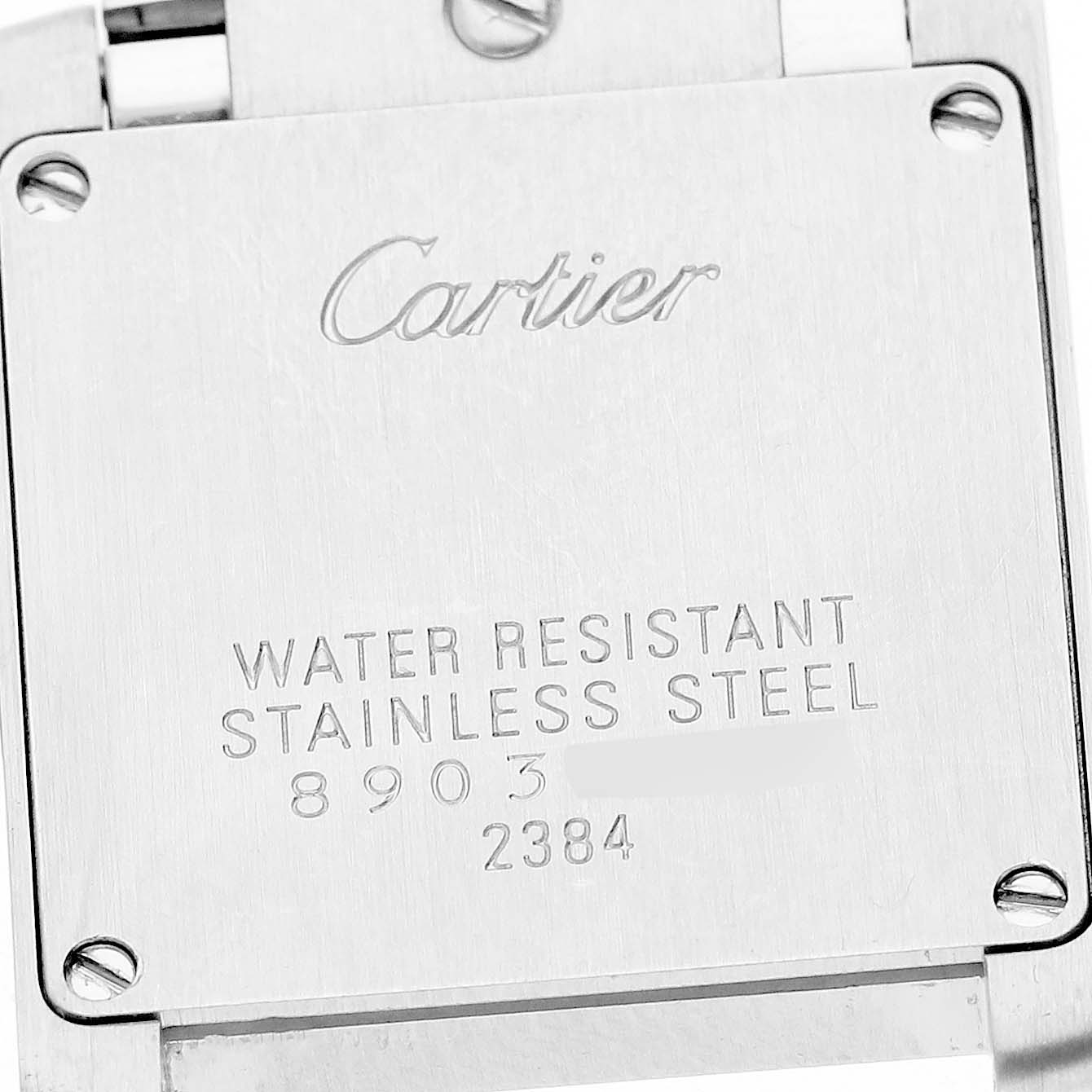 The image shows the back casing of a Cartier Tank Française watch, highlighting its water resistance and stainless steel build.