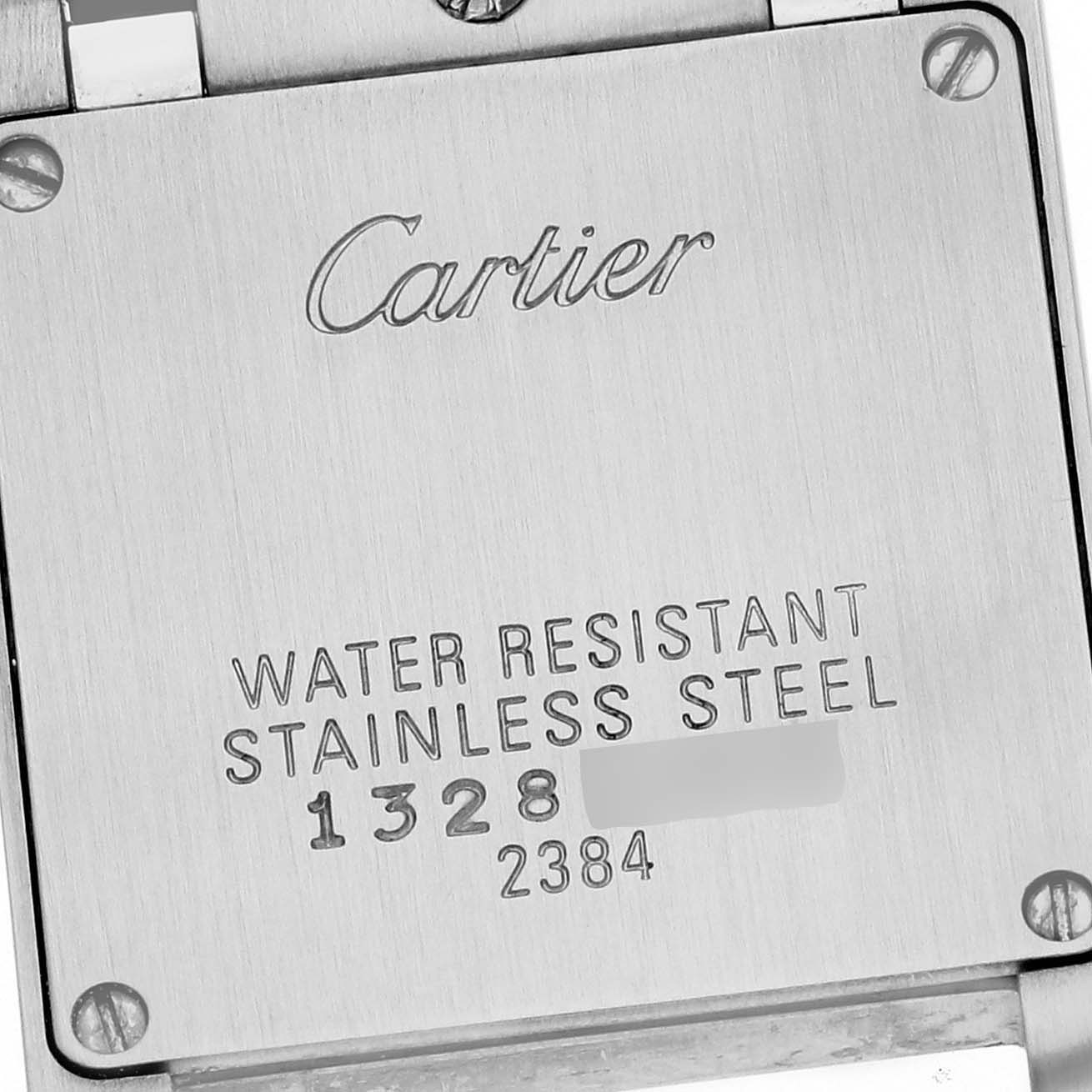 The image shows the back case of a Cartier Tank Francaise W51007Q4 Women
s Stainless Steel Silver Dial W51007Q4 Women
s Stainless Steel Silver Dial watch with engraved details on water resistance and stainless steel.