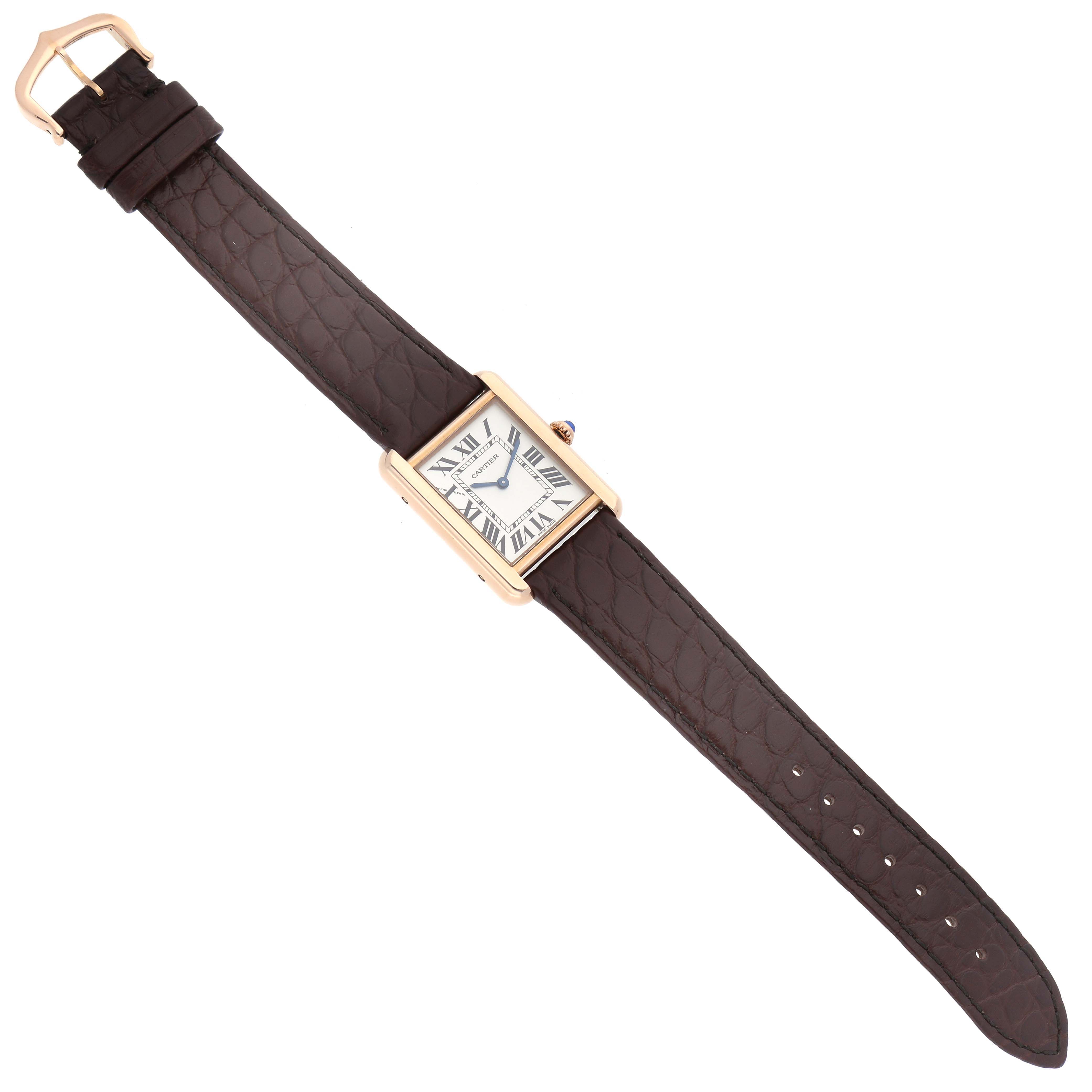 The image shows a Cartier Tank Solo W5200024 Women's Rose Gold Silver Dial W5200024 Women's Rose Gold Silver Dial watch with a rectangular face, Roman numerals, and a brown leather strap from a top view.