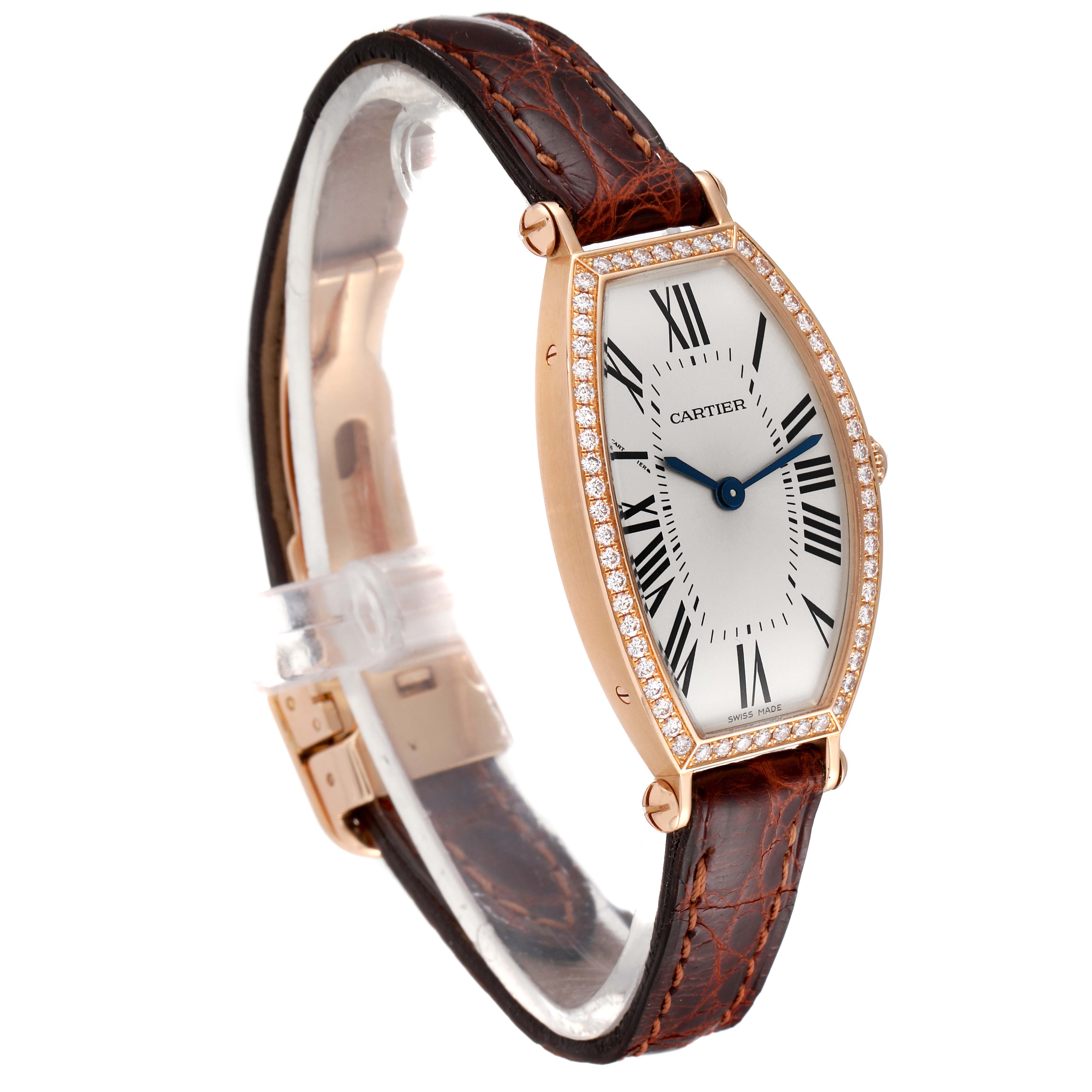 The Tonneau model by Cartier is shown from a side angle, featuring its face, bezel, and leather strap.