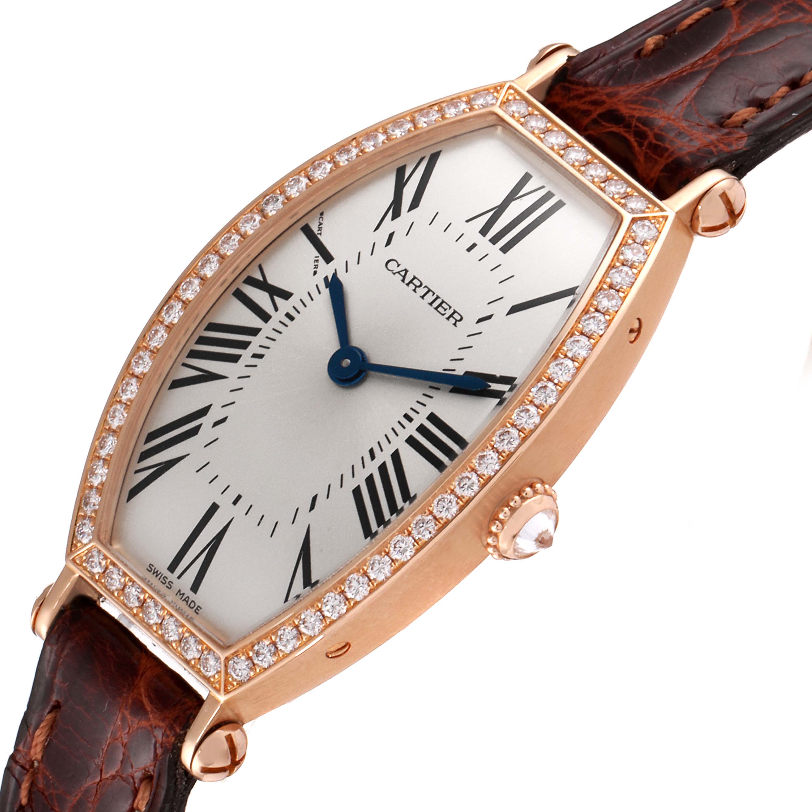 The Cartier Tonneau WE400331 Women's Rose Gold Silver Dial WE400331 Women's Rose Gold Silver Dial watch is shown at an angle highlighting its diamond-studded case, Roman numerals, and brown leather strap.