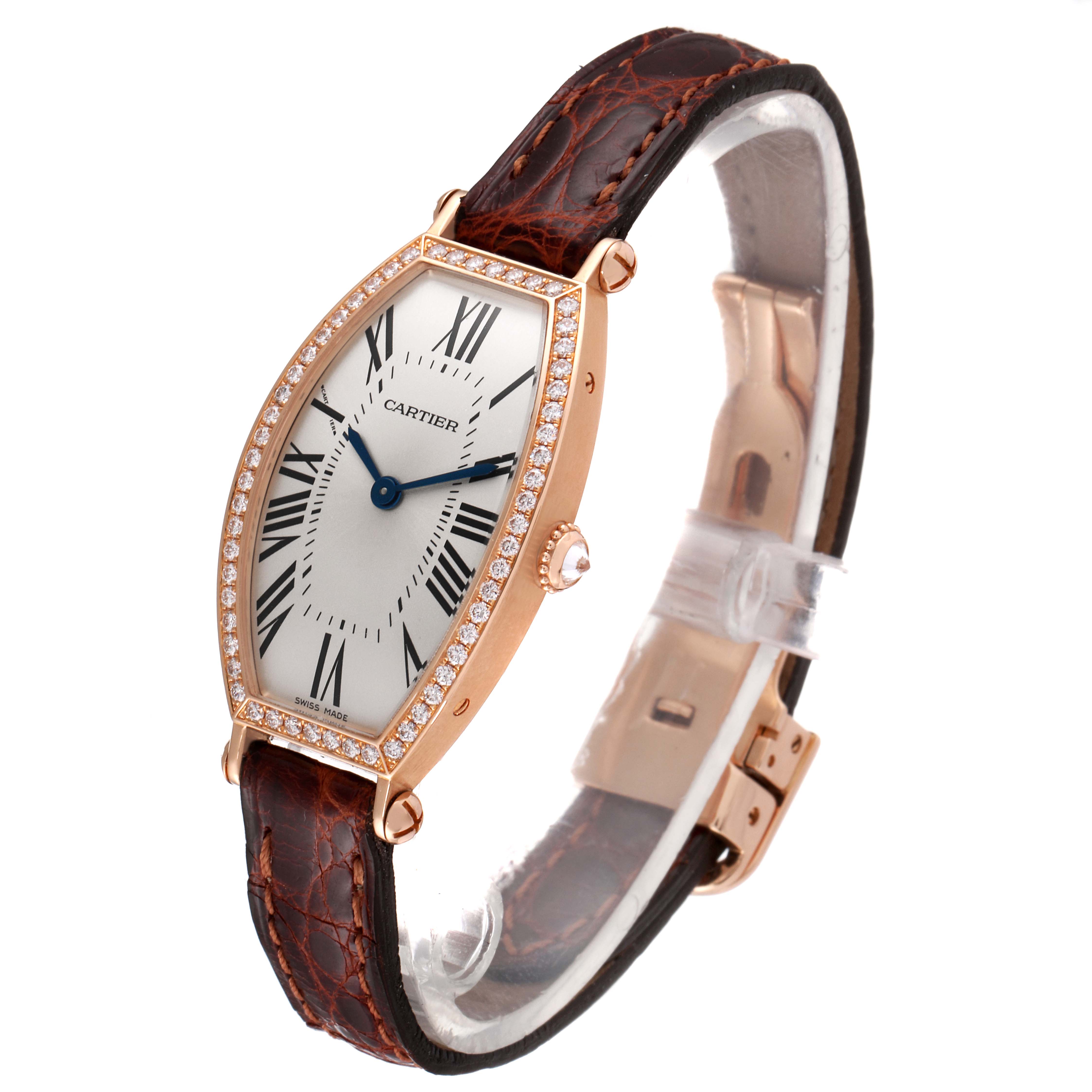 This image shows a Cartier Tonneau WE400331 Women's Rose Gold Silver Dial WE400331 Women's Rose Gold Silver Dial model watch at a three-quarter angle, highlighting its diamond bezel, white dial, and leather strap.
