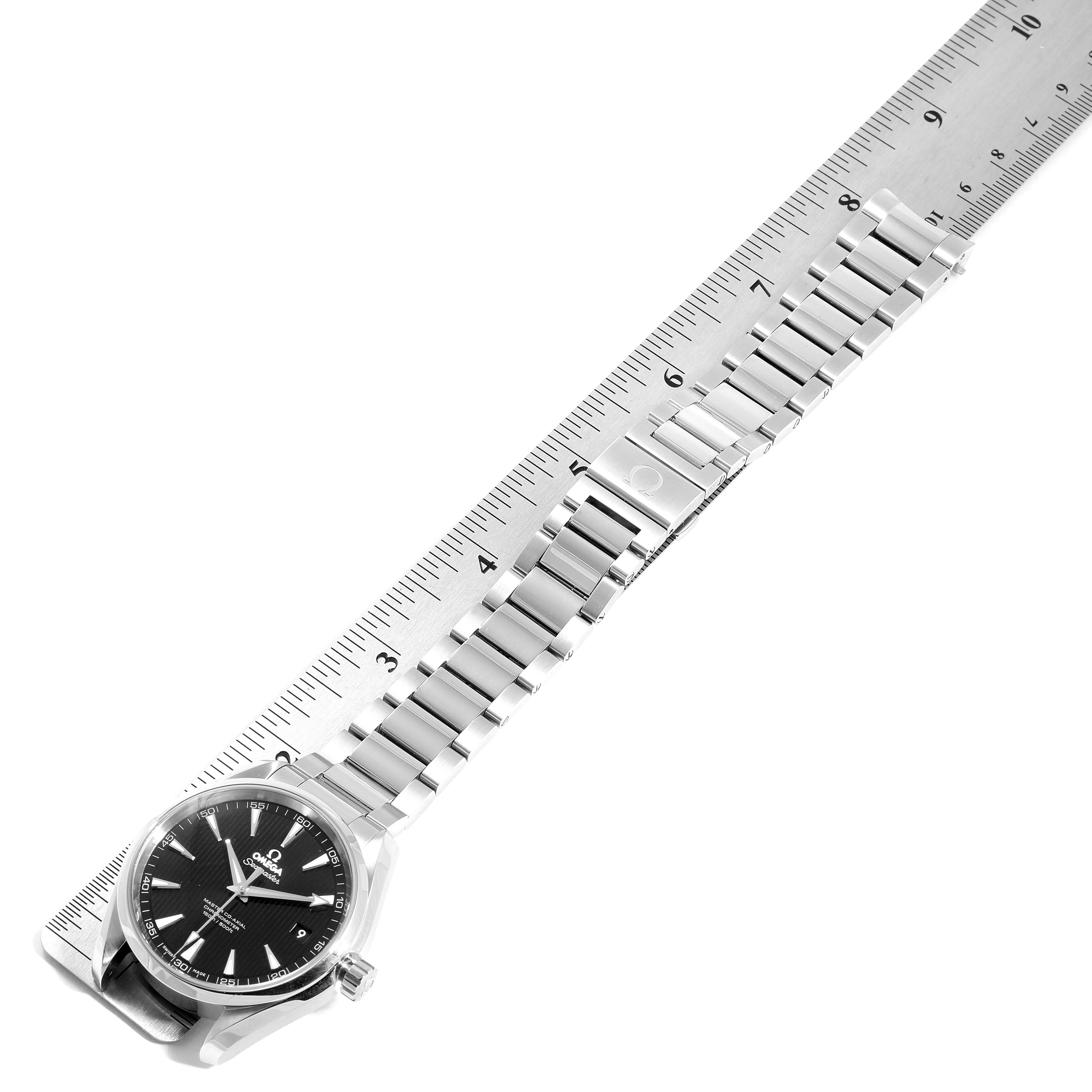 The Omega Aqua Terra 231.10.42.21.01.003 Men
s Stainless Steel Black Dial 231.10.42.21.01.003 Men
s Stainless Steel Black Dial watch is shown from a top-down angle, highlighting its face and stainless steel bracelet against a ruler.