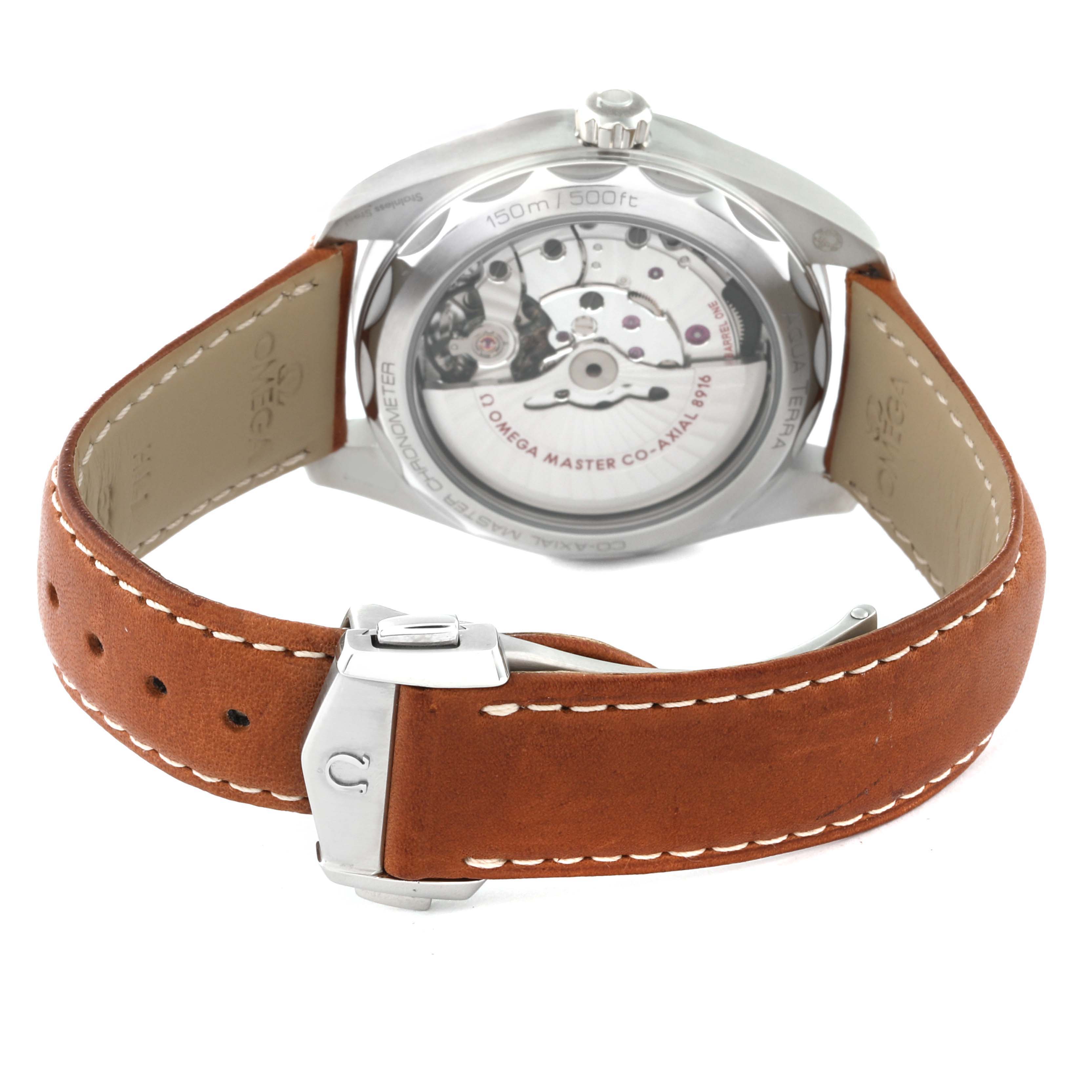 The image shows the back view of the Omega Aqua Terra 220.12.41.21.03.005 Men
s Stainless Steel Blue Dial 220.12.41.21.03.005 Men
s Stainless Steel Blue Dial watch, highlighting its movement and brown leather strap with a clasp.